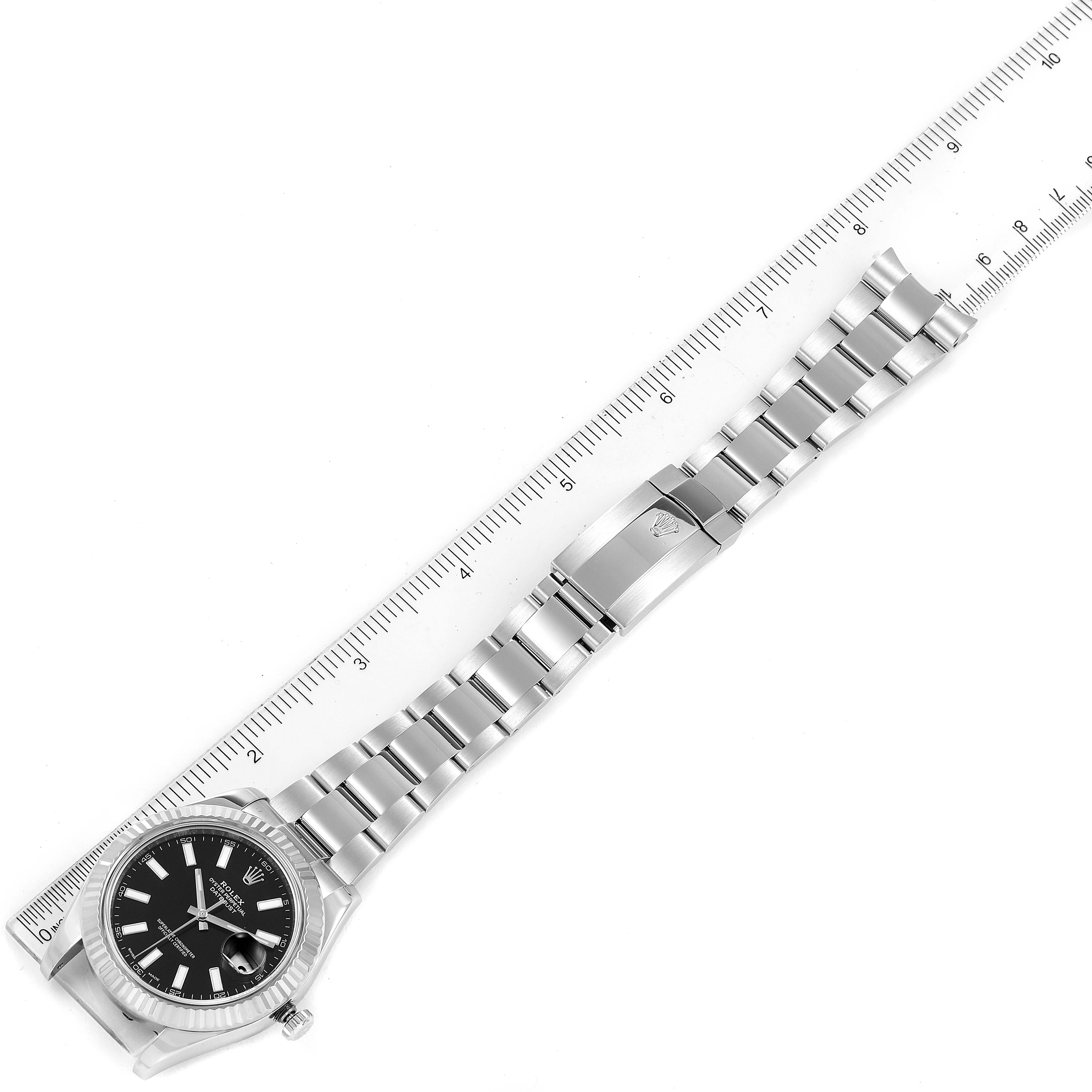 The Rolex Datejust 41 116334 Men
s Stainless Steel Black Dial 116334 Men
s Stainless Steel Black Dial watch is shown fully extended alongside a ruler.