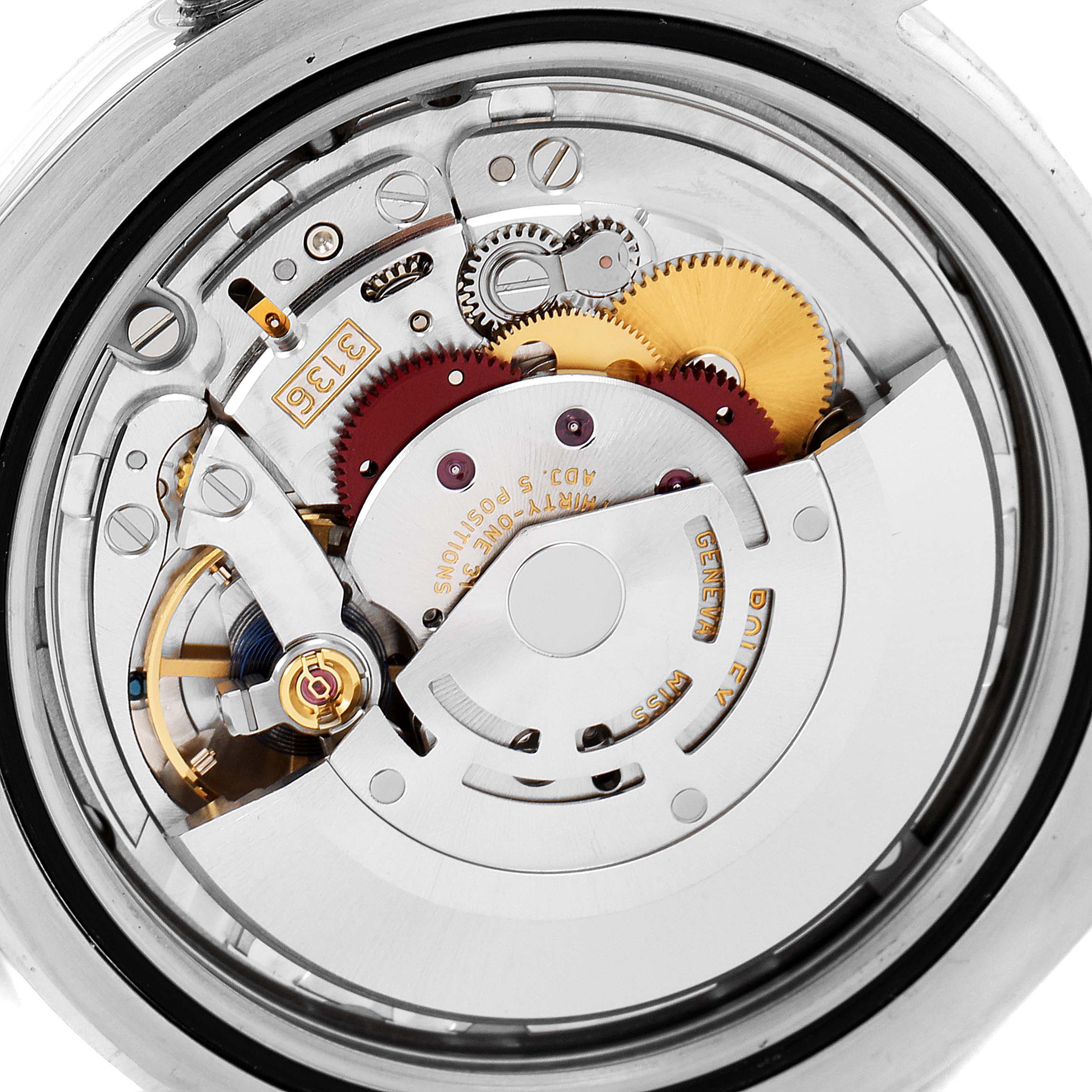 The image shows the inner mechanism of a Rolex Datejust 41 116334 Men
s Stainless Steel Black Dial 116334 Men
s Stainless Steel Black Dial watch from a close-up angle, highlighting gears and components.