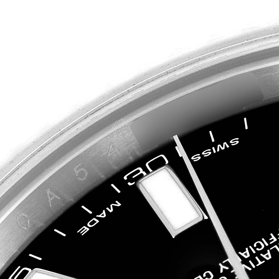 This close-up image of the Rolex Datejust 41 116334 Men
s Stainless Steel Black Dial 116334 Men
s Stainless Steel Black Dial watch shows part of the dial with hour markers and text, focusing on the 30-minute marker.