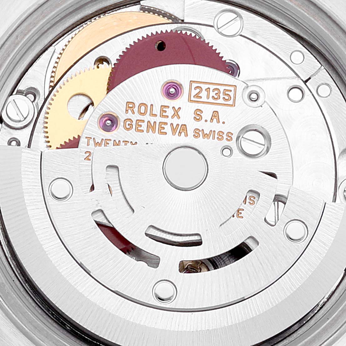 Close-up of the movement parts and engraving inside a Rolex Datejust 69174 Women's Stainless Steel Pink Dial 69174 Women's Stainless Steel Pink Dial watch.