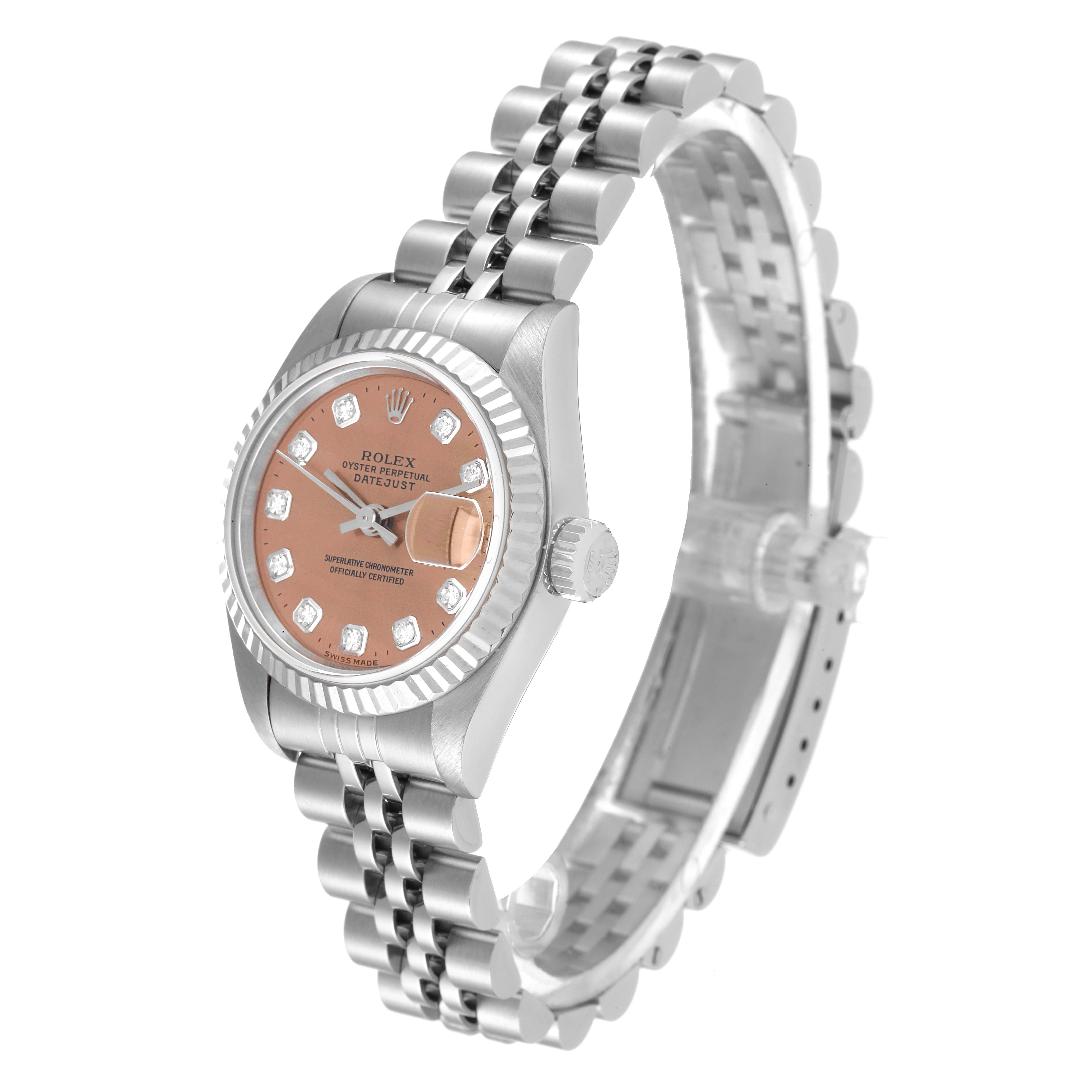 This image shows a Rolex Datejust 69174 Women's Stainless Steel Pink Dial 69174 Women's Stainless Steel Pink Dial watch at a slight angle, highlighting its pink dial, diamond hour markers, and jubilee bracelet.