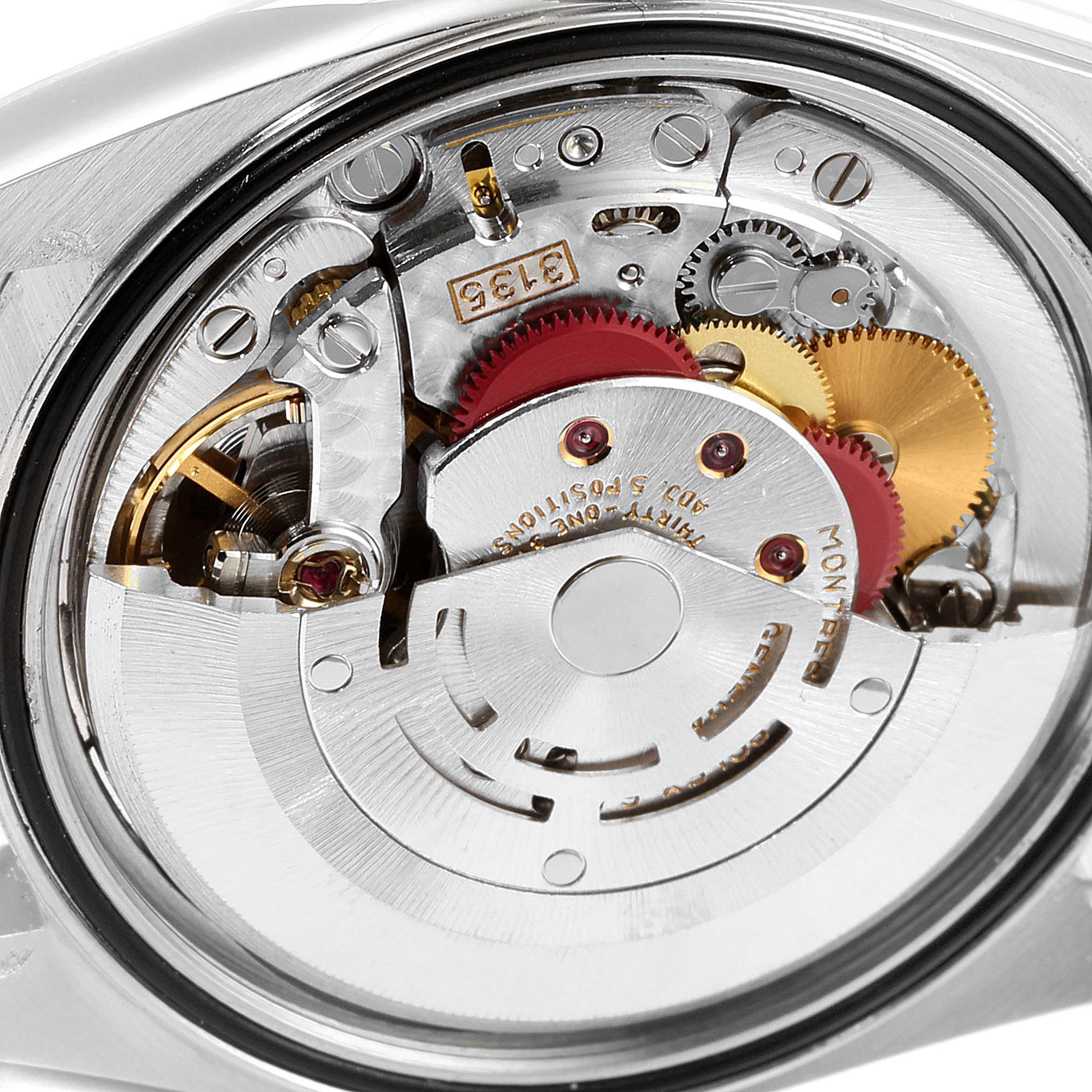 This image shows a close-up view of the movement inside a Rolex Datejust 16234 Men's Stainless Steel Silver Dial 16234 Men's Stainless Steel Silver Dial watch, highlighting its intricate gears and mechanisms.