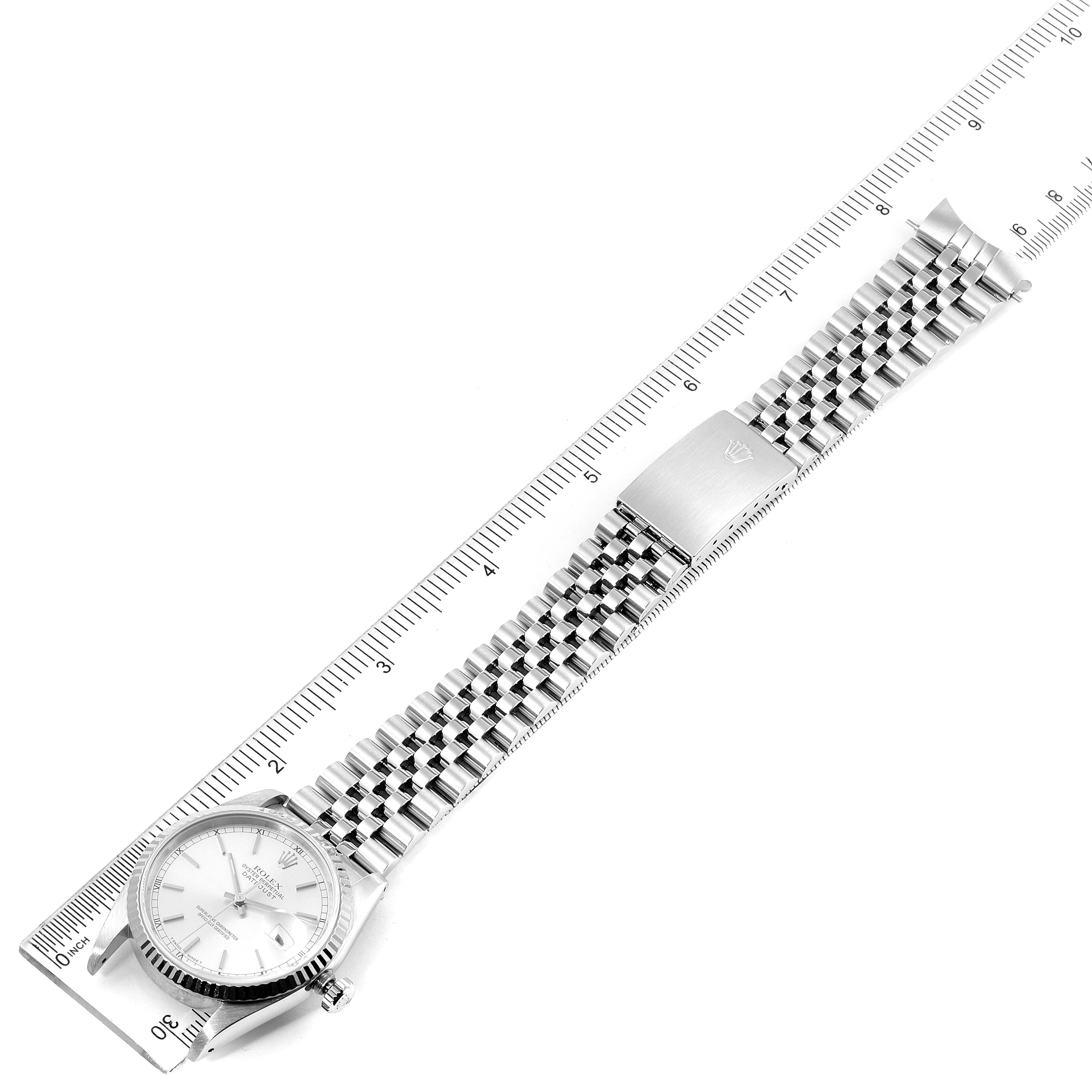 The image shows a top-down view of a Rolex Datejust 16234 Men's Stainless Steel Silver Dial 16234 Men's Stainless Steel Silver Dial watch, including the face, case, and full bracelet, beside a measuring ruler.