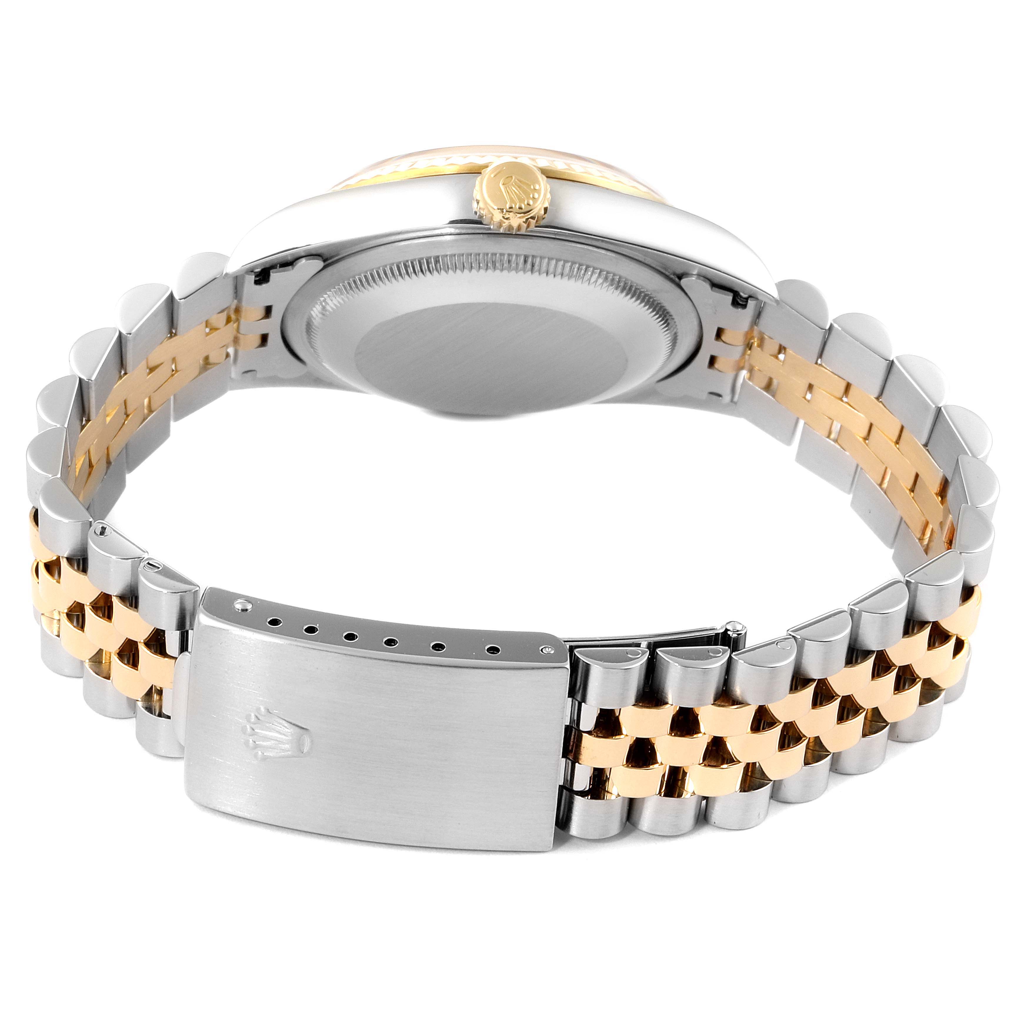 This image shows the back view and bracelet of a Rolex Datejust 16233 Men's Steel and Gold (two tone) Champagne Dial 16233 Men's Steel and Gold (two tone) Champagne Dial watch, highlighting its two-tone stainless steel and gold design.
