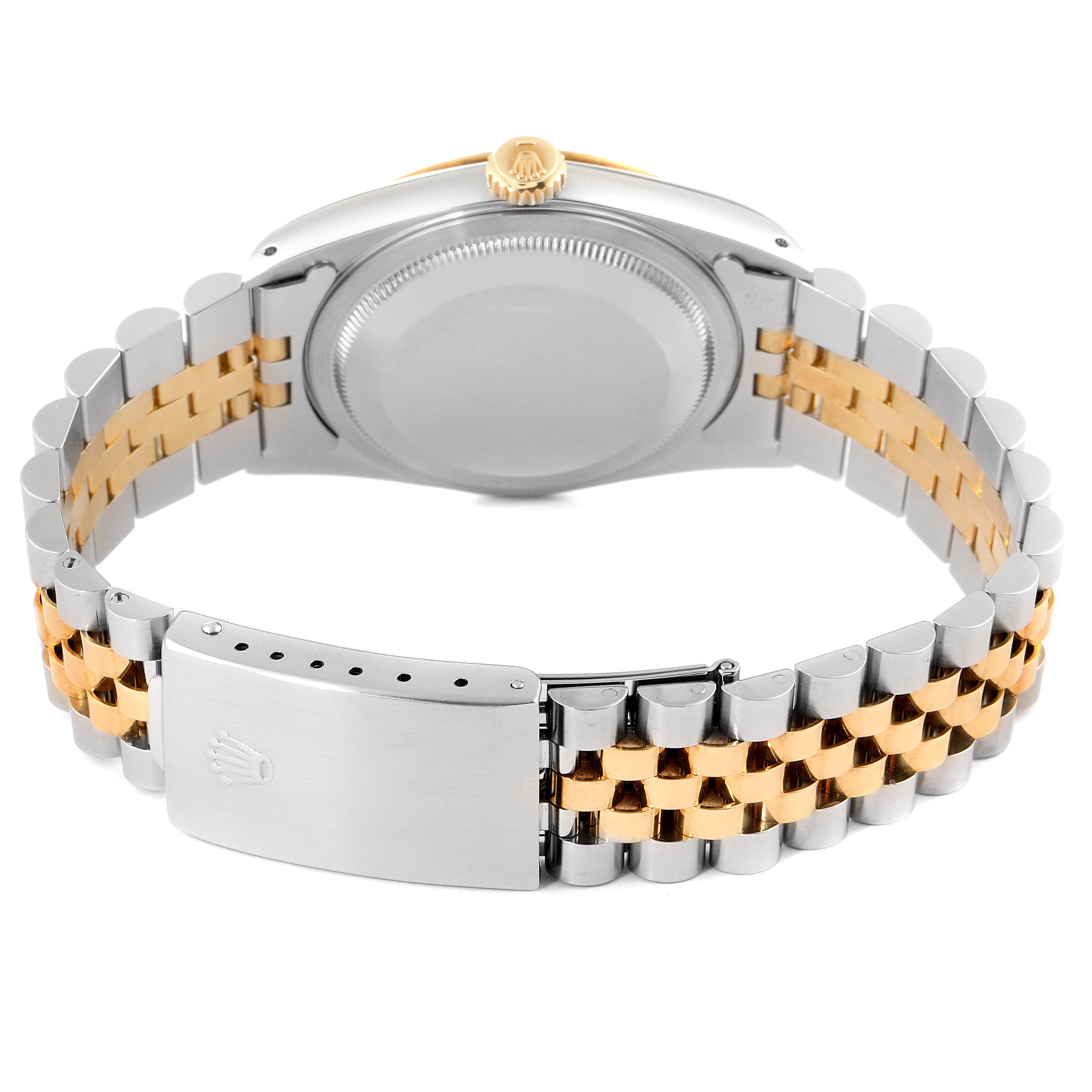The image shows the back case and two-tone bracelet, including the clasp, of a Rolex Datejust 16233 Men's Steel and Gold (two tone) Champagne Dial 16233 Men's Steel and Gold (two tone) Champagne Dial watch.