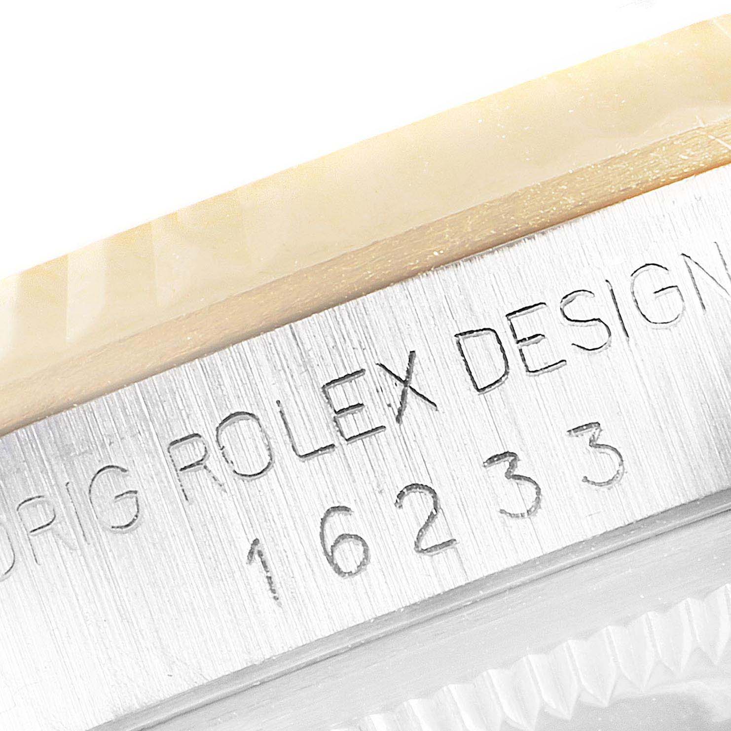 This image shows an engraved serial number and design details on the steel casing of a Rolex Datejust 16233 Men's Steel and Gold (two tone) Champagne Dial 16233 Men's Steel and Gold (two tone) Champagne Dial model.