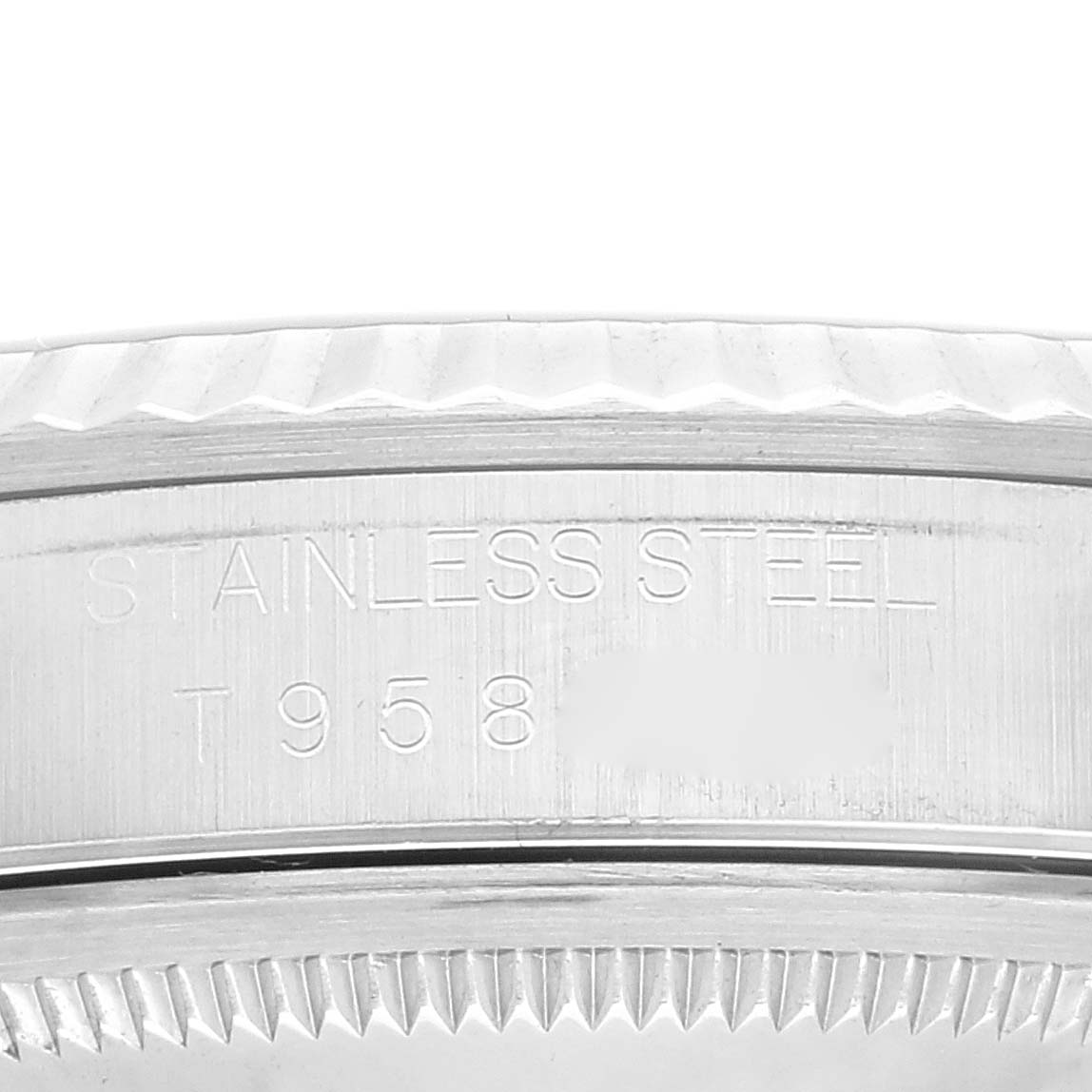 This image shows the side of a Rolex Datejust 16234 Men's Stainless Steel Blue Dial 16234 Men's Stainless Steel Blue Dial watch, featuring its stainless steel detail and part of the serial number.