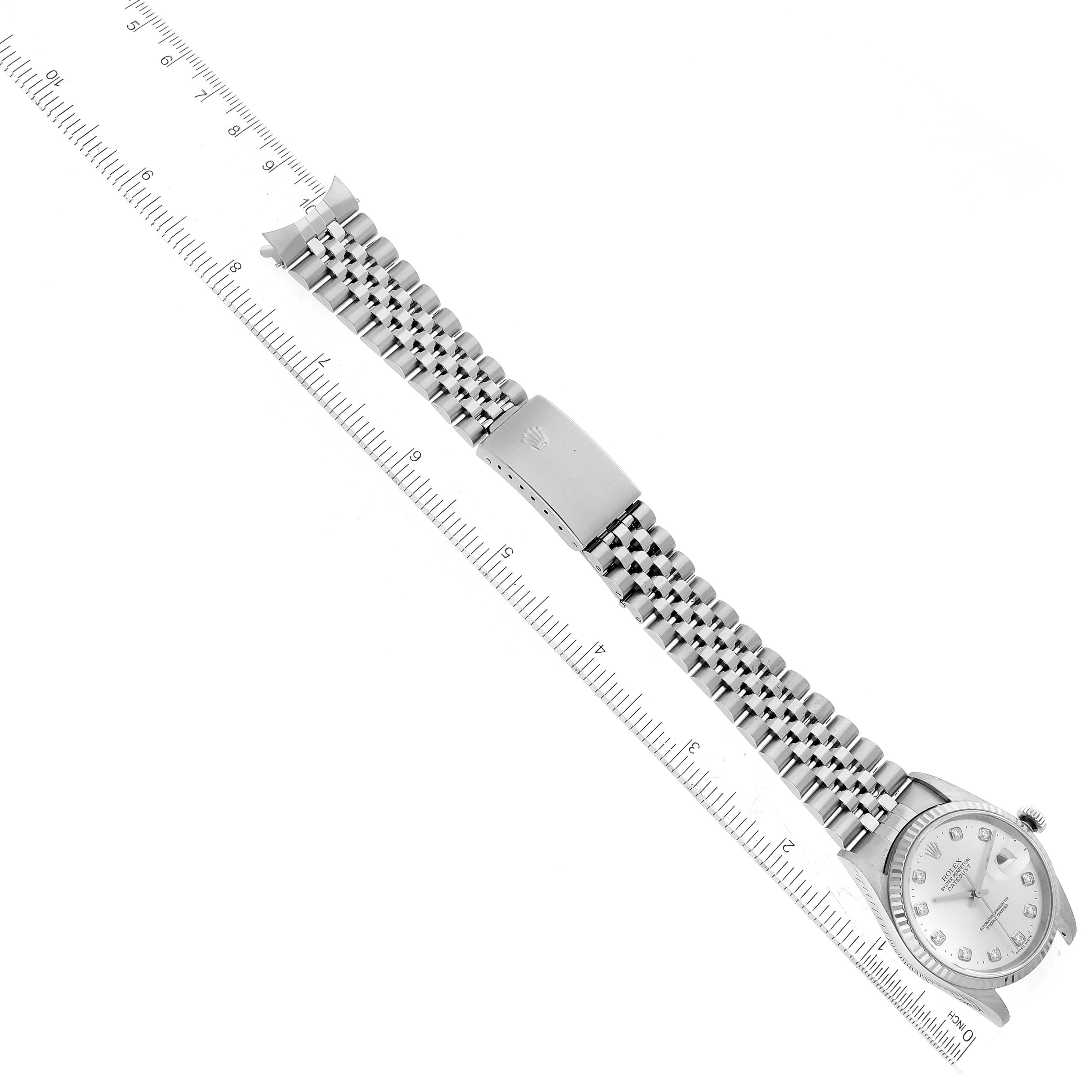 The image shows a Rolex Datejust 16234 Men's Stainless Steel Silver Dial 16234 Men's Stainless Steel Silver Dial watch laid flat with a ruler for scale, highlighting the bracelet and clasp.