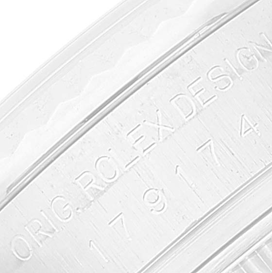 This image shows the engraved inner bezel of a Rolex Datejust 179174 Women's Stainless Steel Mother of Pearl Dial 179174 Women's Stainless Steel Mother of Pearl Dial watch.