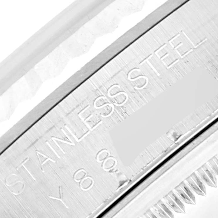 This image shows a close-up of the stainless steel case back with engraving on a Datejust model by Rolex.