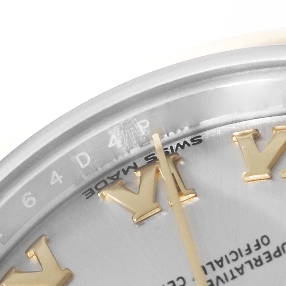 This close-up image of a Rolex Datejust 279163 Women's Steel and Gold (two tone) Silver Dial 279163 Women's Steel and Gold (two tone) Silver Dial watch shows part of the dial, including the Roman numeral markers and "Swiss Made" inscription.
