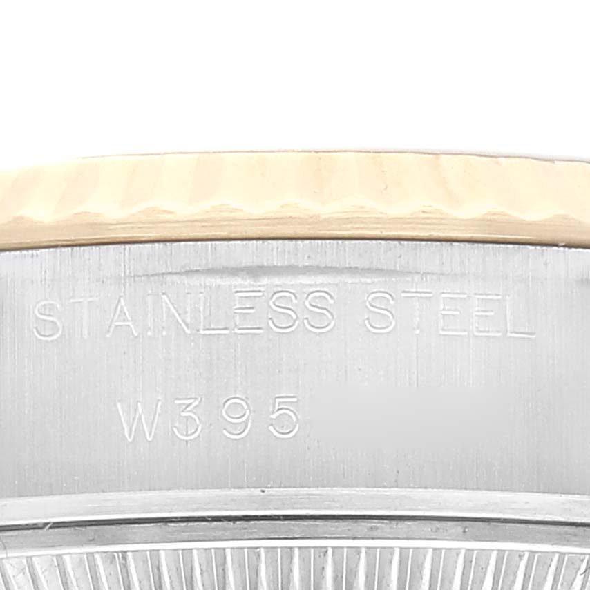 The image shows a close-up of a stainless steel part of a Rolex Datejust 69173 Women's Steel and Gold (two tone) Champagne Dial 69173 Women's Steel and Gold (two tone) Champagne Dial watch, highlighting the inscription.