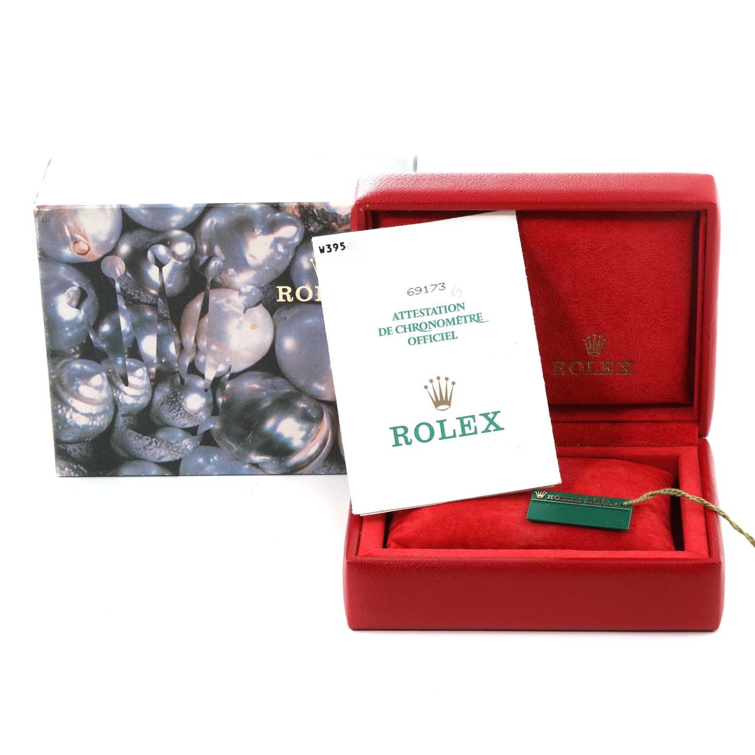 The image shows the packaging, documentation, and accessories for a Rolex Datejust 69173 Women's Steel and Gold (two tone) Champagne Dial 69173 Women's Steel and Gold (two tone) Champagne Dial watch, including the box and a tag.