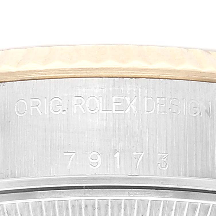 This image shows a side view of the case exterior of a Rolex Datejust 79173 Women's Steel and Gold (two tone) Champagne Dial 79173 Women's Steel and Gold (two tone) Champagne Dial watch, featuring the text "ORIG. ROLEX DESIGN" and the reference number.