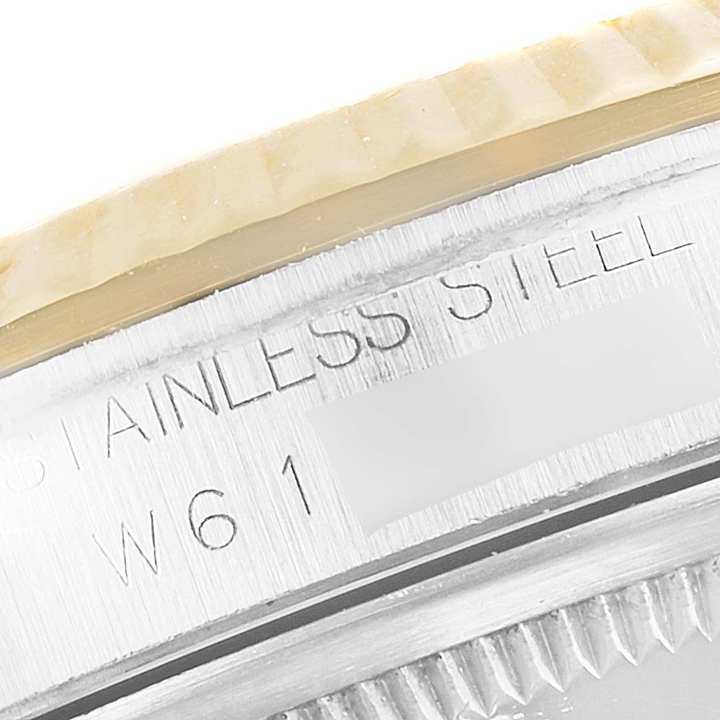 The image shows a close-up of the outer edge and engravings on the stainless steel case of a Rolex Datejust 16233 Men's Stainless Steel Blue Dial 16233 Men's Stainless Steel Blue Dial watch.