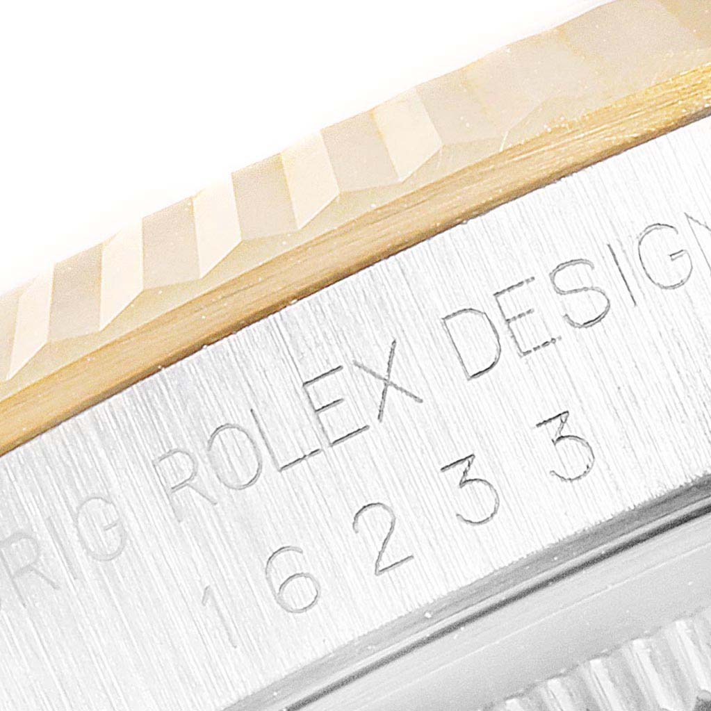 This close-up image shows the bezel and engraving on a Rolex Datejust 16233 Men's Stainless Steel Blue Dial 16233 Men's Stainless Steel Blue Dial watch.