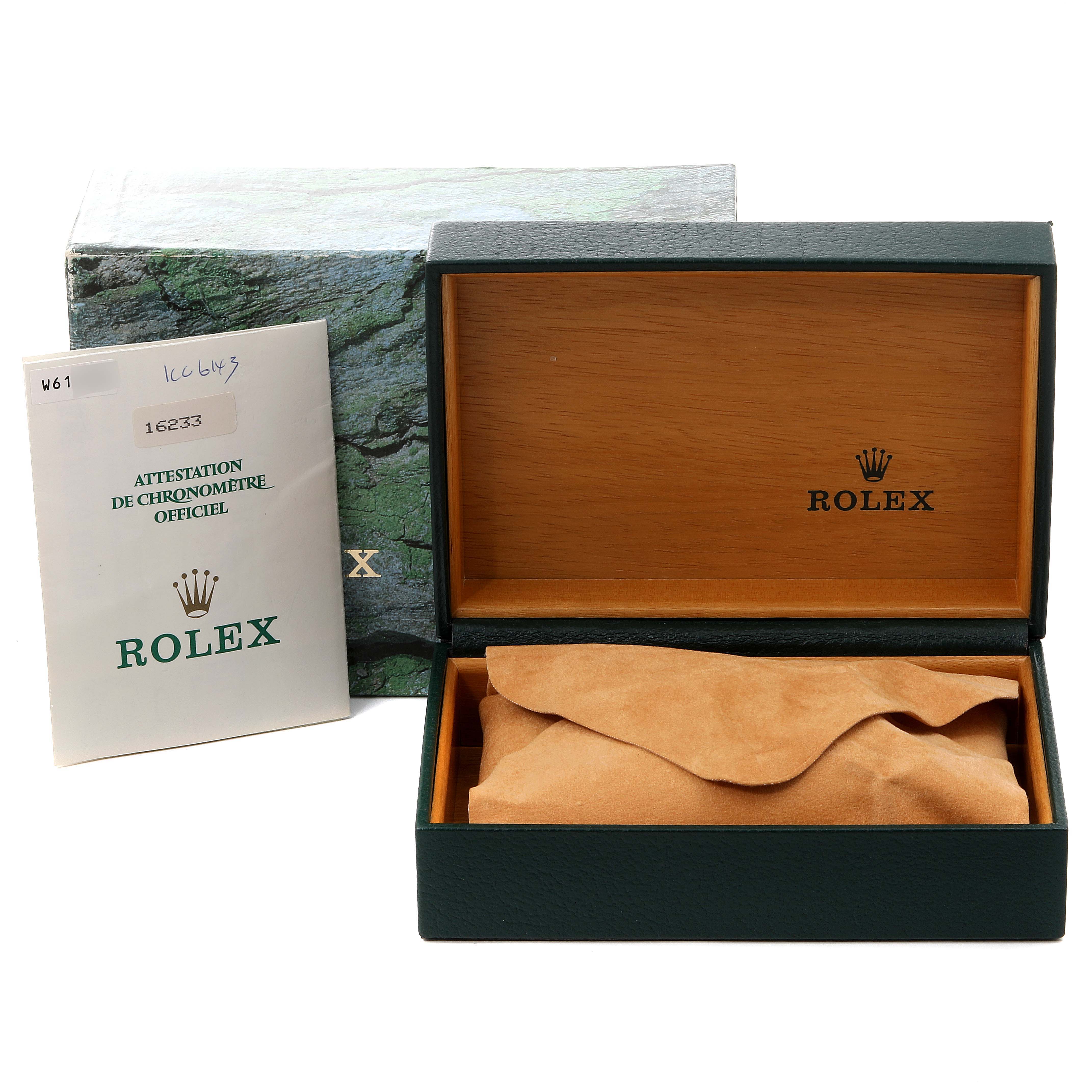 The image shows the accessories for a Rolex Datejust 16233 Men's Stainless Steel Blue Dial 16233 Men's Stainless Steel Blue Dial, including an open box, a green cardboard box, and a booklet.