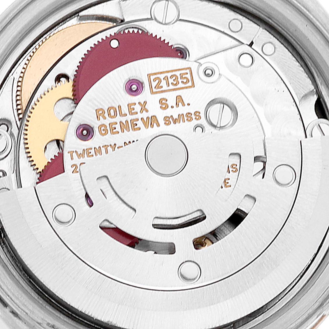 The image shows a close-up of the movement mechanism inside a Rolex Datejust 69173 Women's Steel and Gold (two tone) Black Dial 69173 Women's Steel and Gold (two tone) Black Dial watch, highlighting gears and the rotor.