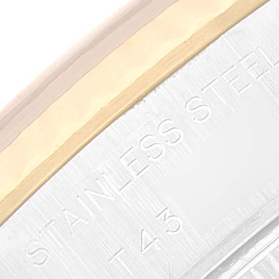 The image shows a close-up of the edge and part of the bezel of a Rolex Datejust 69173 Women's Steel and Gold (two tone) Black Dial 69173 Women's Steel and Gold (two tone) Black Dial watch, highlighting its stainless steel and gold materials.