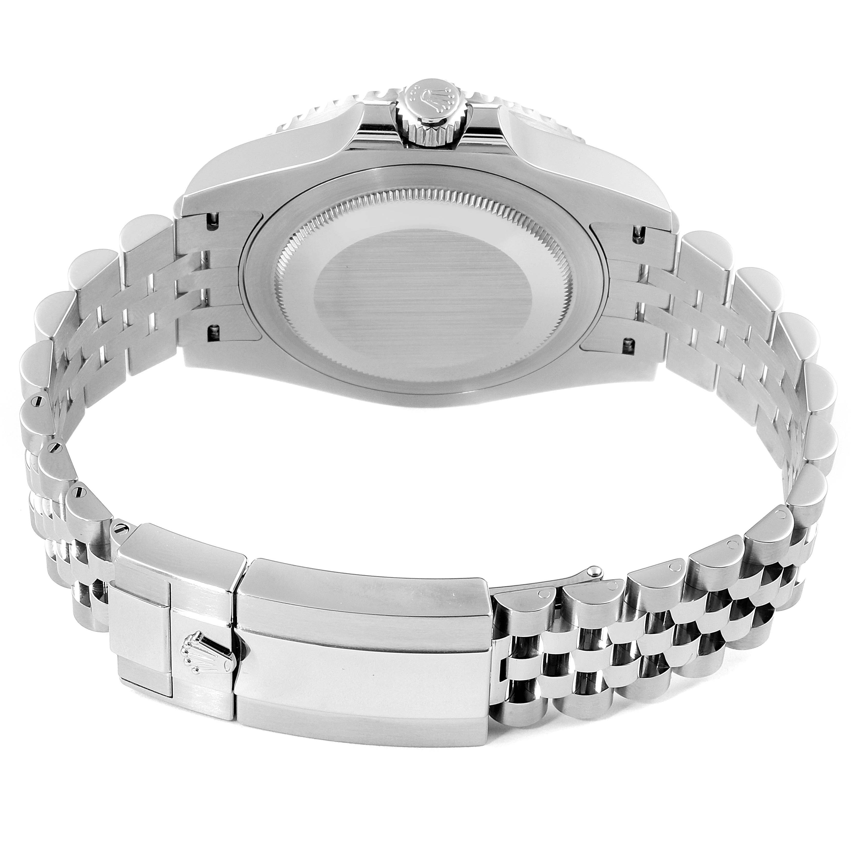 The image shows the back case, crown, and jubilee bracelet of a Rolex GMT-Master 126710 Men
s Stainless Steel Black Dial 126710 Men
s Stainless Steel Black Dial watch from a rear angle.