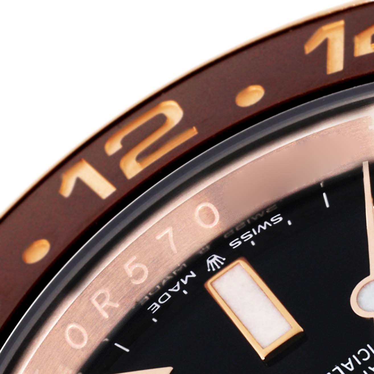 The close-up image of the Rolex GMT-Master 126715 Men
s Rose Gold Black Dial 126715 Men
s Rose Gold Black Dial watch shows the watch face, including part of the bezel and dial.