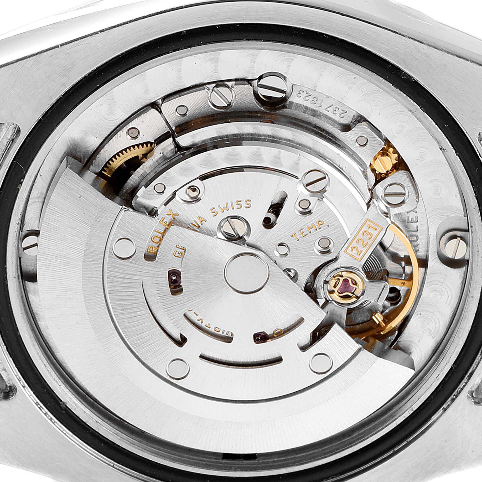 The image shows a close-up of the movement mechanism of a Mid-Size Rolex watch.