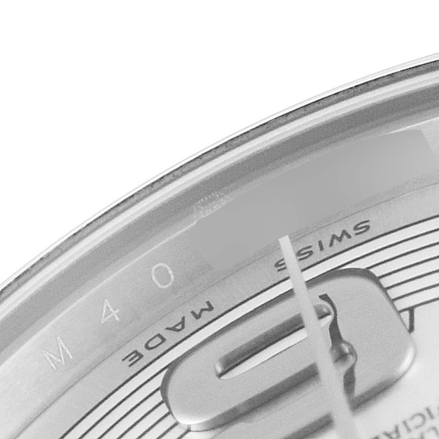 The image shows a close-up of the Rolex Mid-Size 177200 Women
s Stainless Steel Silver Dial 177200 Women
s Stainless Steel Silver Dial watch face, focusing on the dial and part of the "SWISS MADE" text.