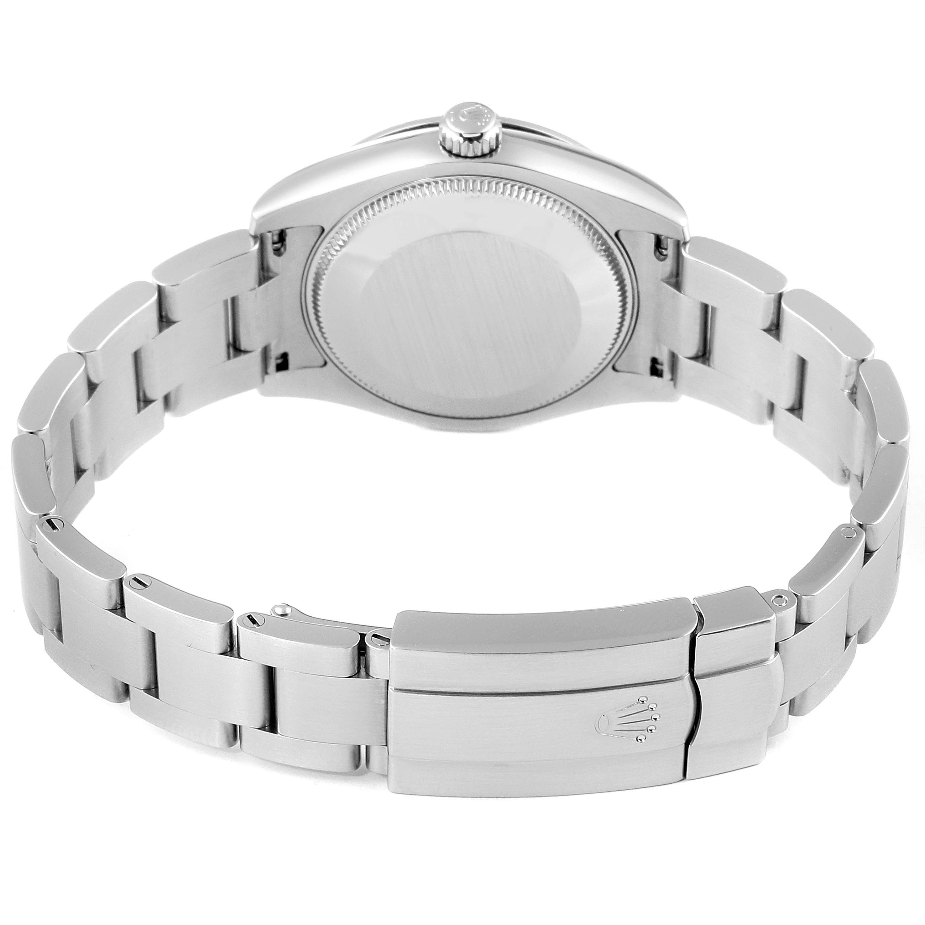 The image shows the back view of a Mid-Size Rolex watch, highlighting its clasp, bracelet, and case back.