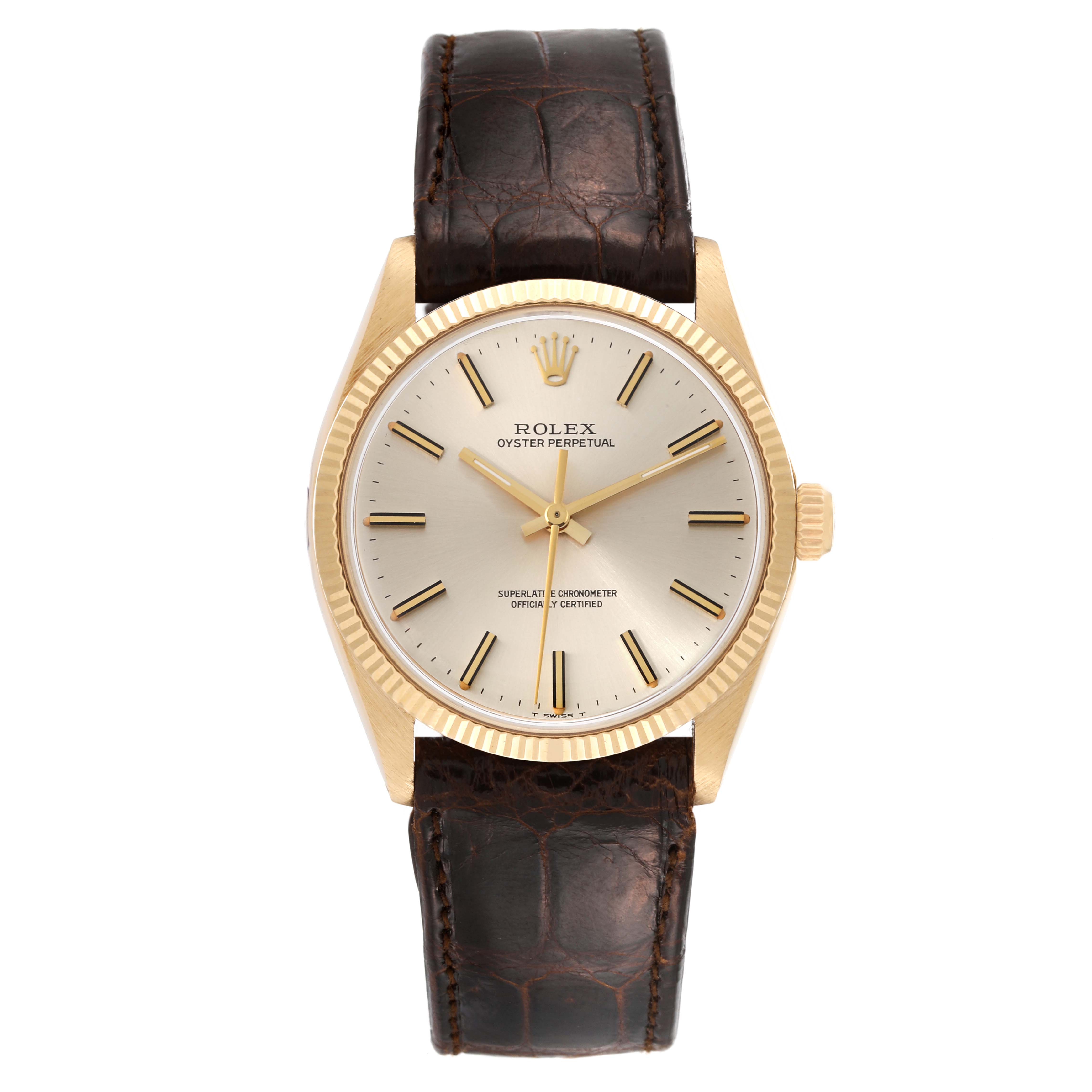 The Rolex Vintage Collection 1005 Men's Yellow Gold Champagne Dial 1005 Men's Yellow Gold Champagne Dial watch is shown in a frontal view, displaying the face, bezel, and leather strap.