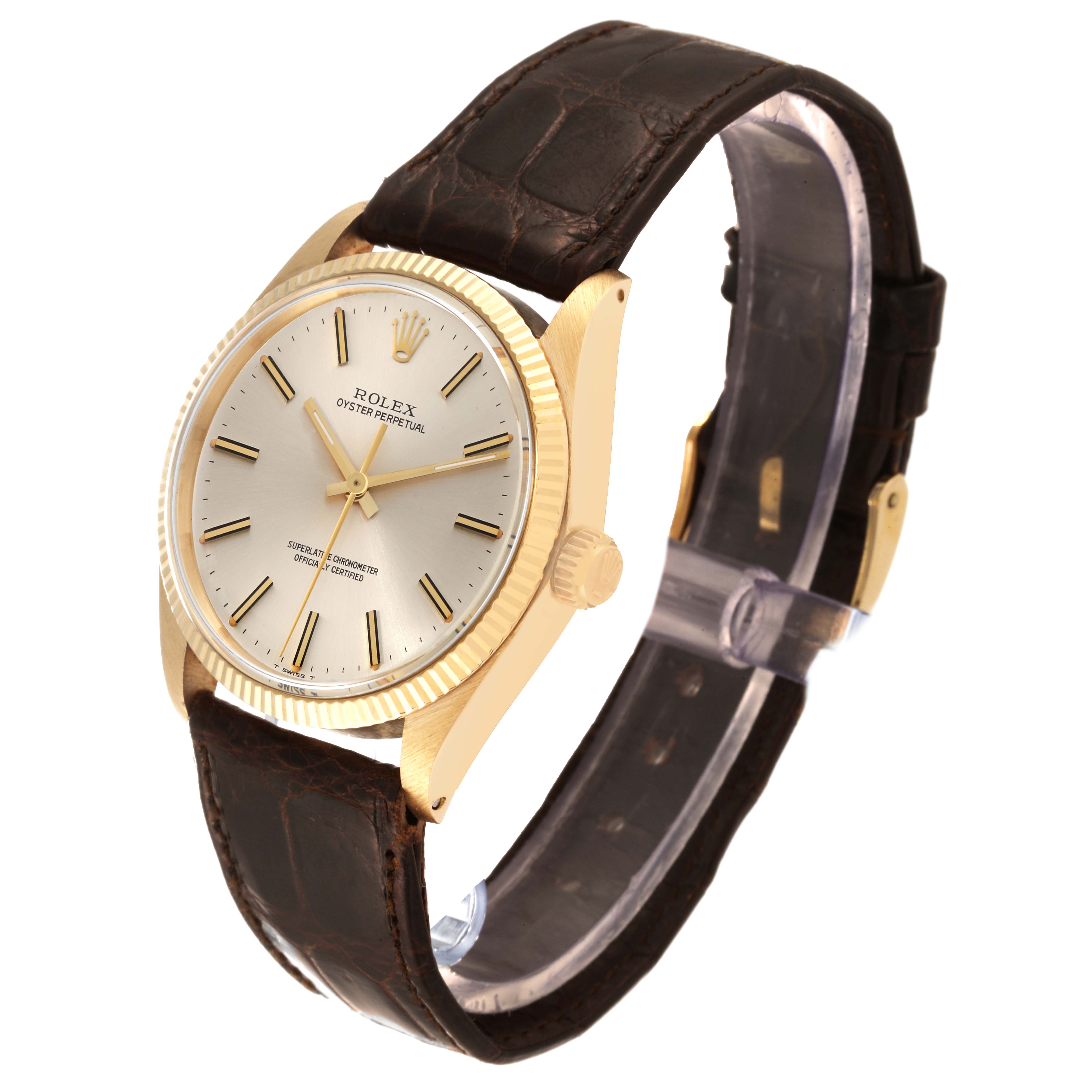 The Rolex Vintage Collection 1005 Men's Yellow Gold Champagne Dial 1005 Men's Yellow Gold Champagne Dial watch is shown at a three-quarter angle, displaying the face, bezel, crown, and leather strap.