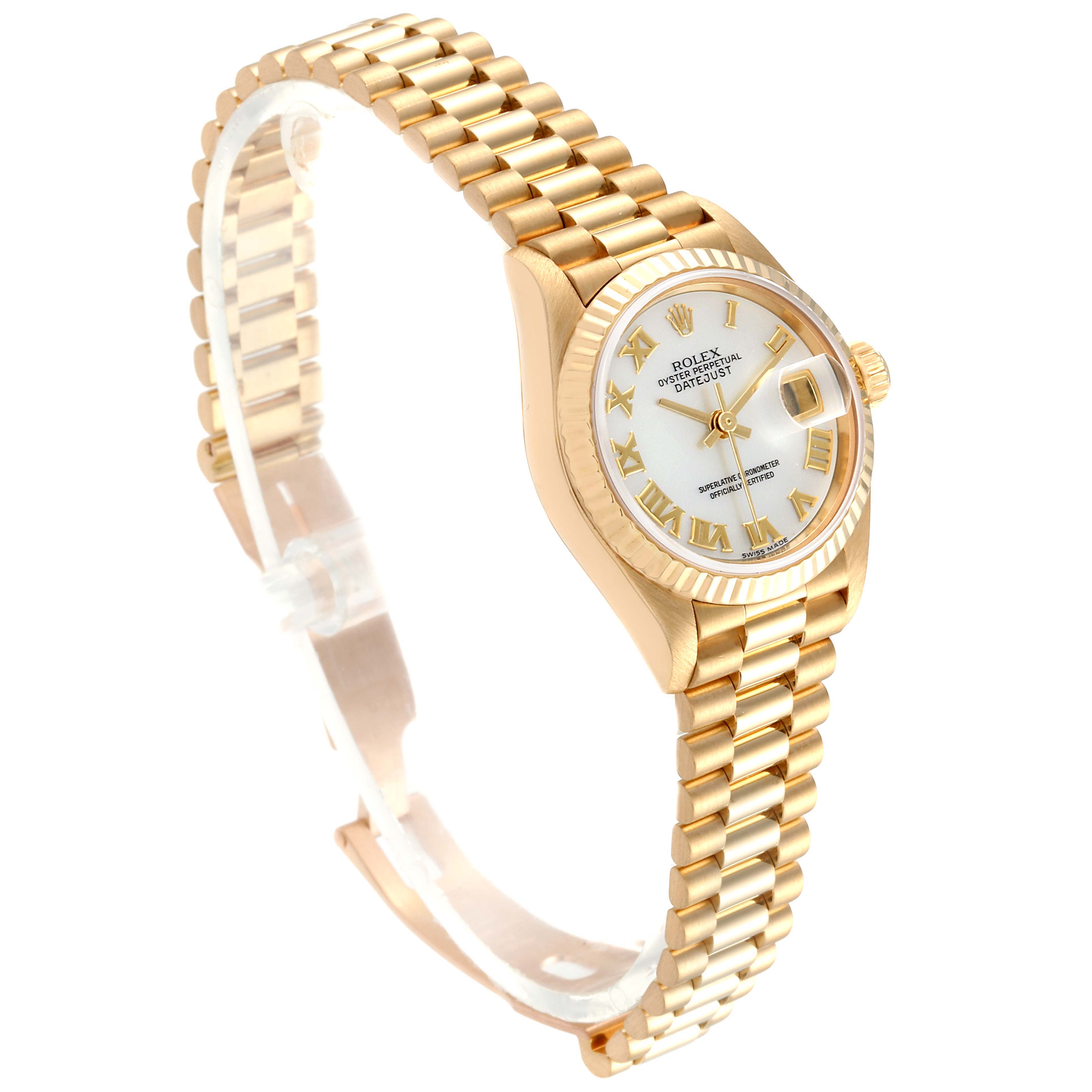 The image shows a Rolex President 79178 Women
s Yellow Gold Mother of Pearl Dial 79178 Women
s Yellow Gold Mother of Pearl Dial model watch, highlighting its gold bracelet, white dial, fluted bezel, and date window.