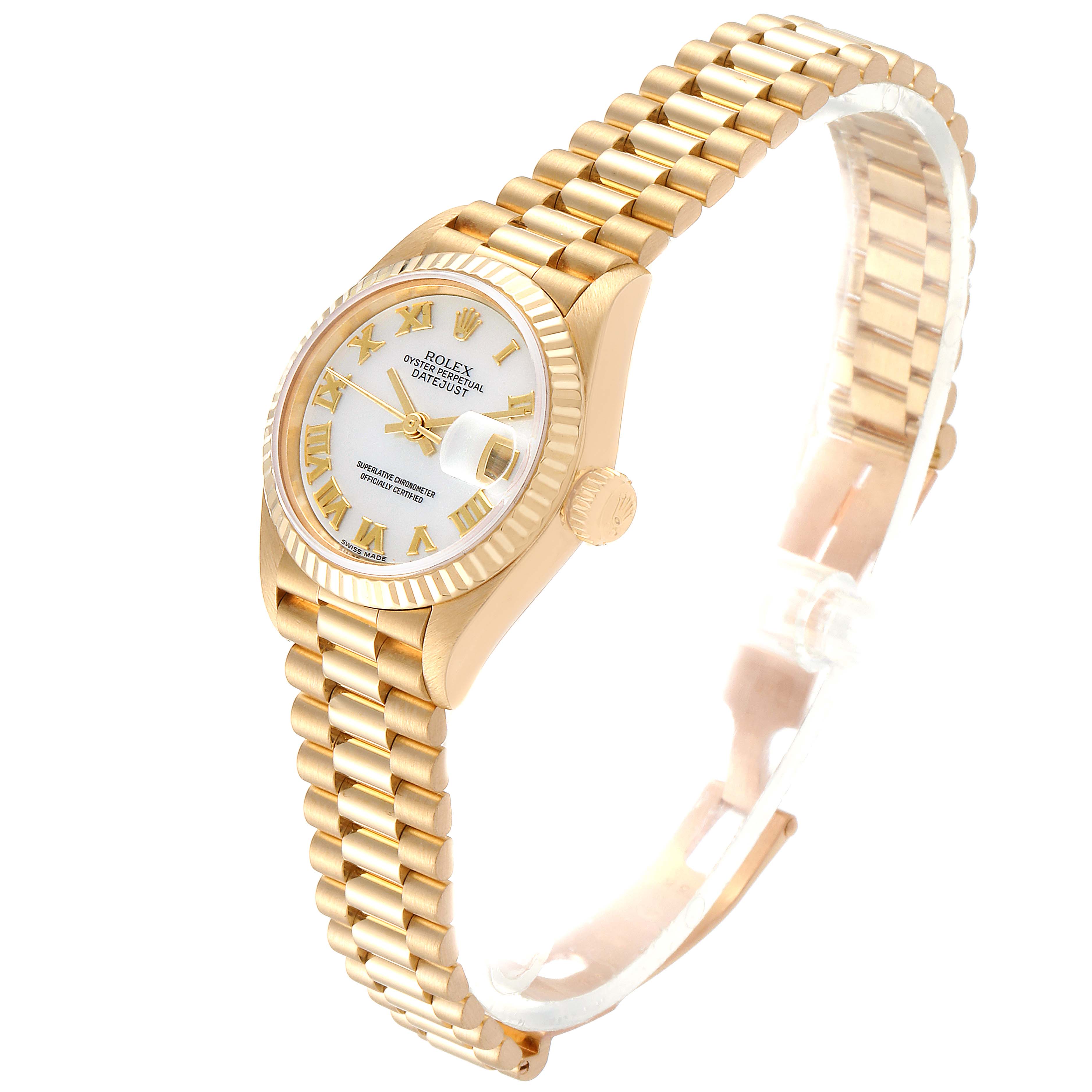 The image shows a Rolex President 79178 Women
s Yellow Gold Mother of Pearl Dial 79178 Women
s Yellow Gold Mother of Pearl Dial model watch from a high-angle view, highlighting its face, bezel, crown, and bracelet.