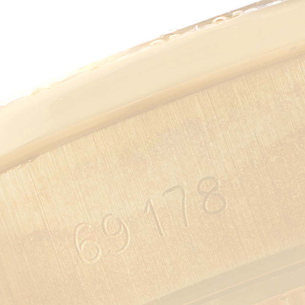 This image shows a close-up of the case side of a Rolex President 69178 Women's Yellow Gold Blue Dial 69178 Women's Yellow Gold Blue Dial model watch, highlighting the engraved model number.