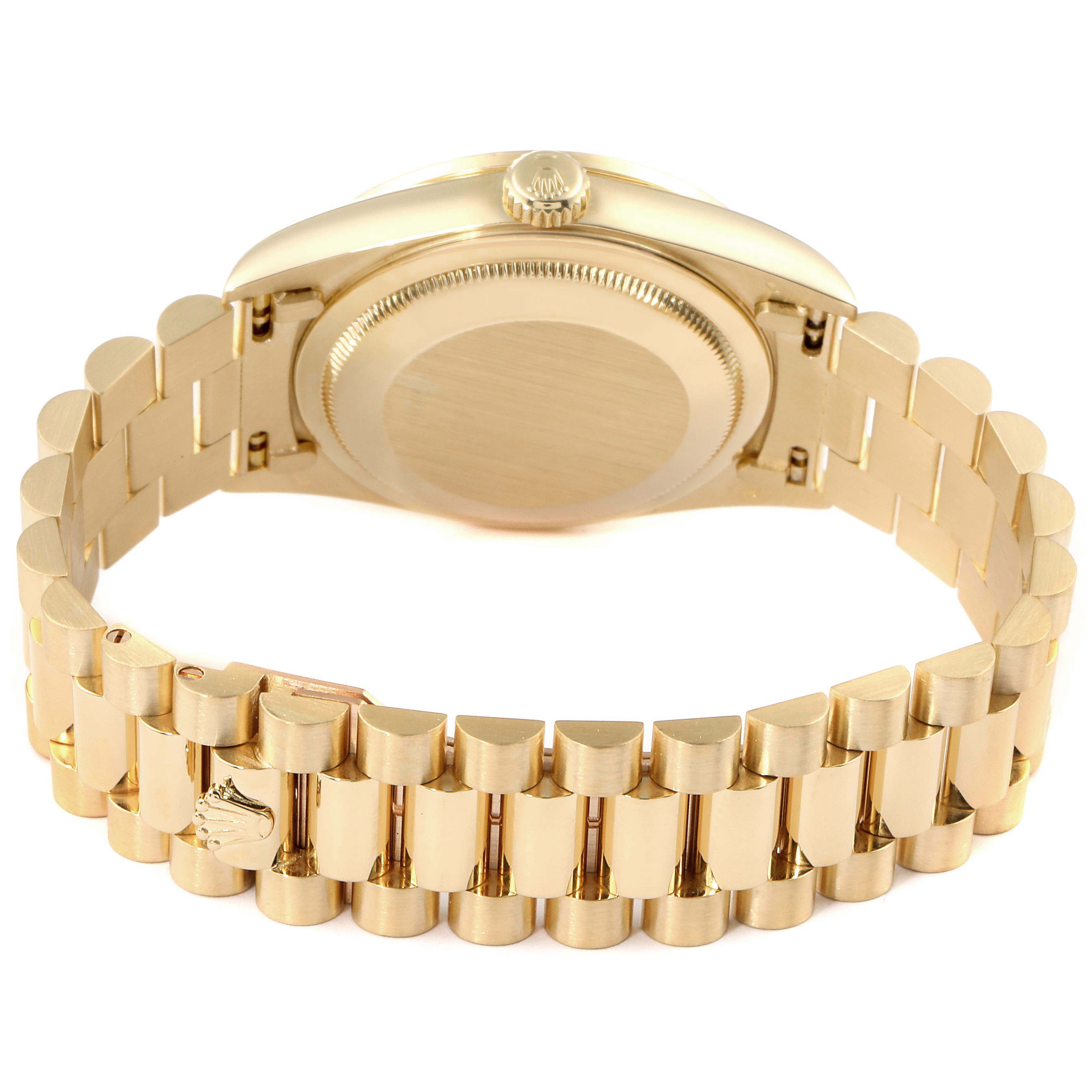 This image shows the underside of the Rolex President 18348 Men's Yellow Gold Champagne Dial 18348 Men's Yellow Gold Champagne Dial model watch, highlighting its gold bracelet and case back.