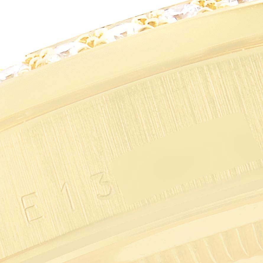 This close-up image shows the bezel and part of the case with engravings of a Rolex President 18348 Men's Yellow Gold Champagne Dial 18348 Men's Yellow Gold Champagne Dial model watch.