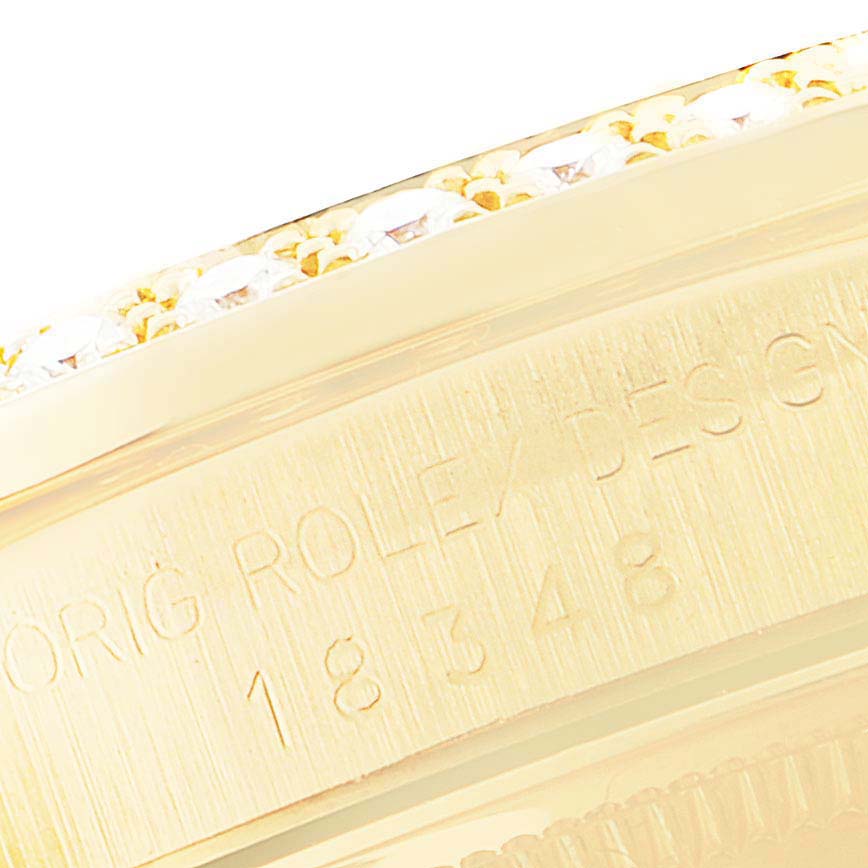 This close-up image shows the engraved details on the edge of a Rolex President 18348 Men's Yellow Gold Champagne Dial 18348 Men's Yellow Gold Champagne Dial model watch case.