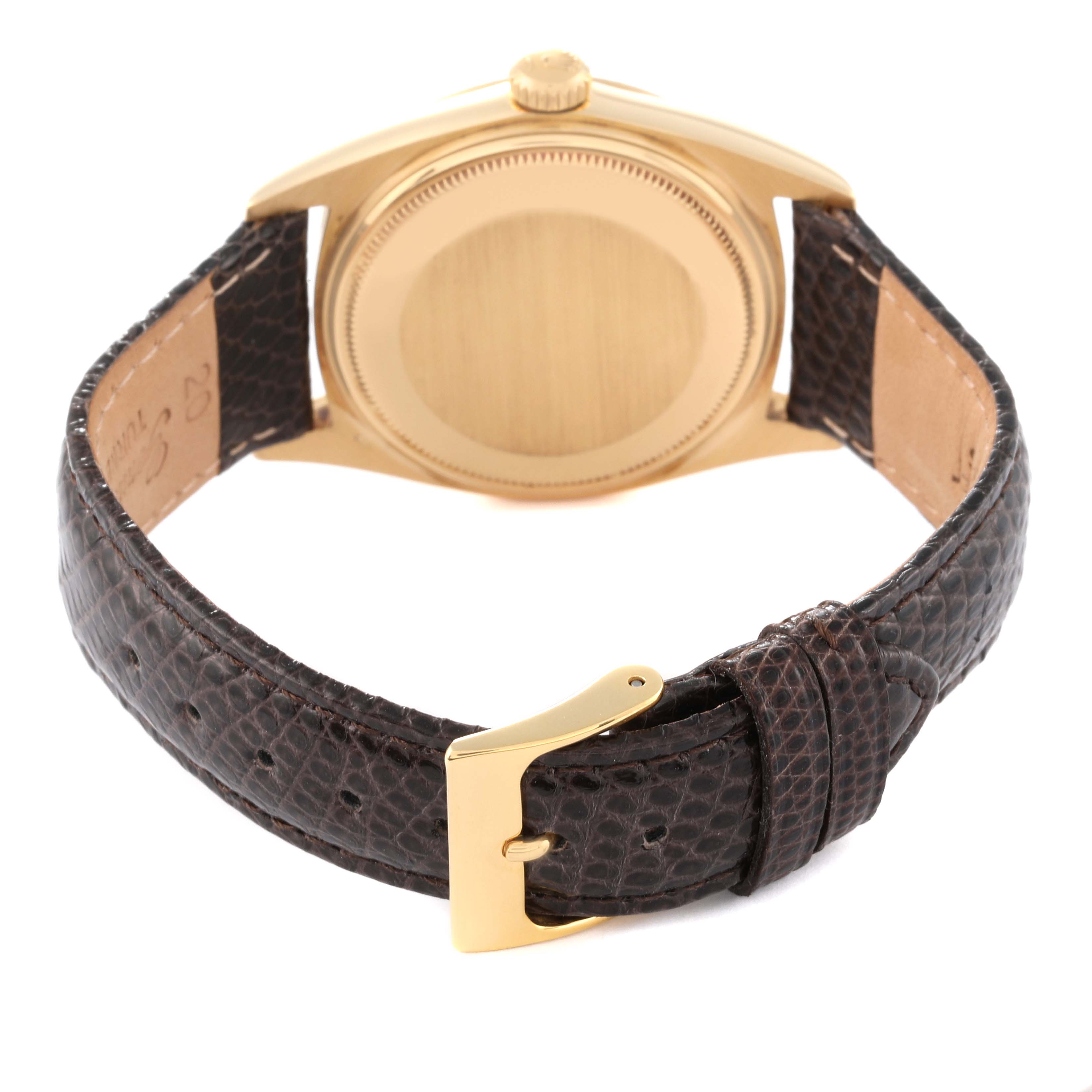 The image shows the back view of the Rolex Vintage Collection 1803 Men's Yellow Gold Champagne Dial 1803 Men's Yellow Gold Champagne Dial watch, highlighting its gold case and brown leather strap.