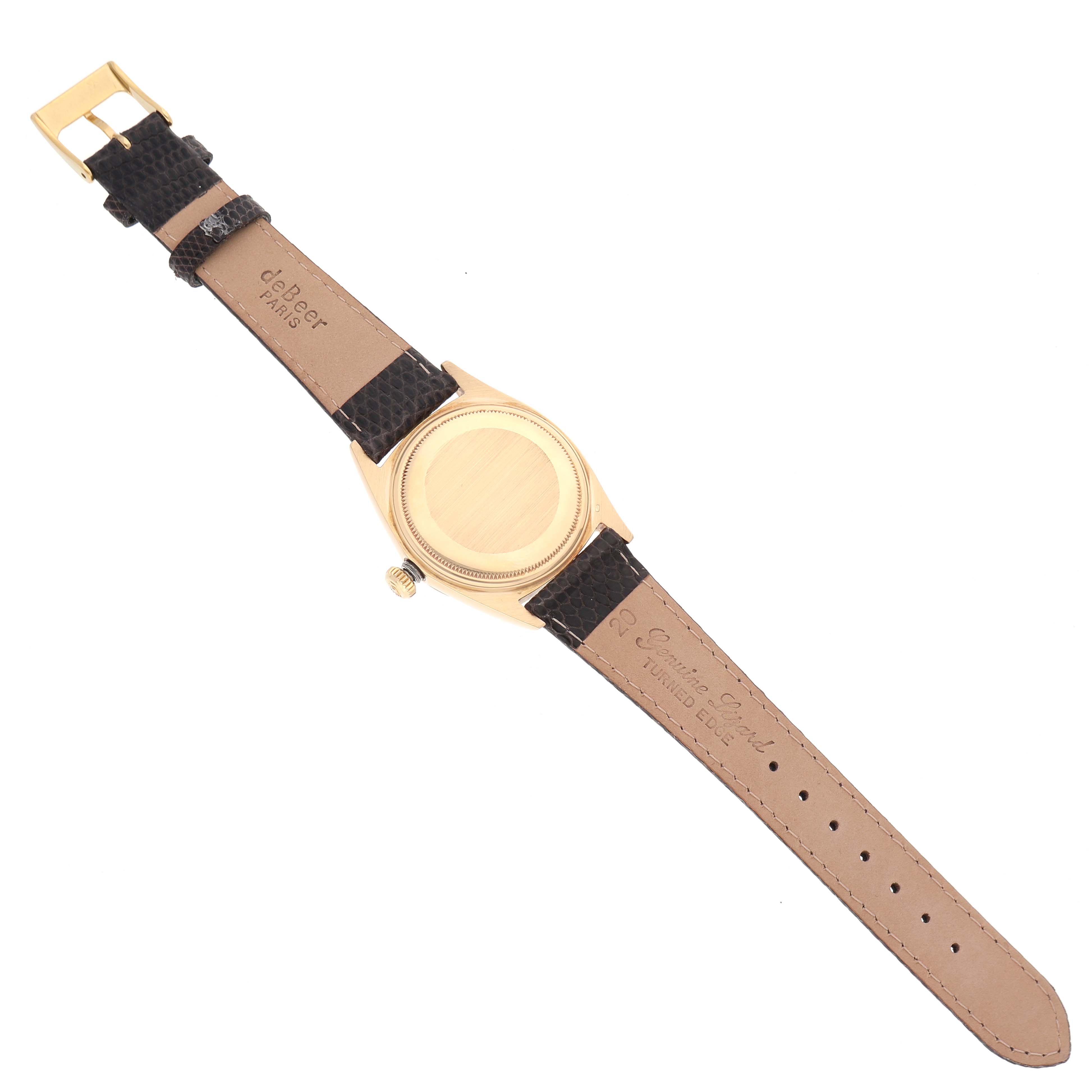 The image shows the back of a Rolex Vintage Collection 1803 Men's Yellow Gold Champagne Dial 1803 Men's Yellow Gold Champagne Dial watch, highlighting the case back, crown, and leather strap.