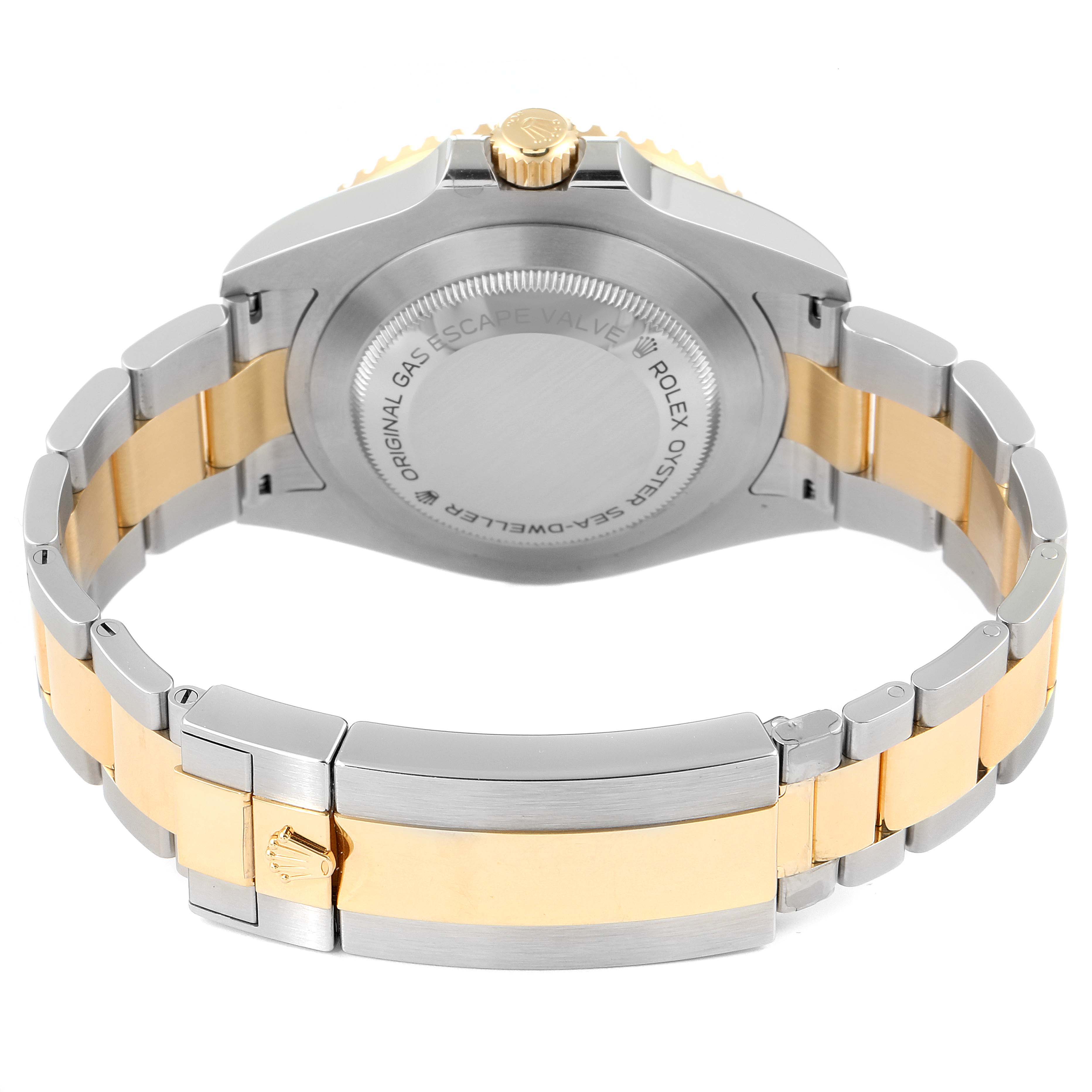 The image shows the back case and bracelet of a Rolex Sea-Dweller 126603 Men
s Steel and Gold (two tone) Black Dial 126603 Men
s Steel and Gold (two tone) Black Dial watch with a two-tone metal design.