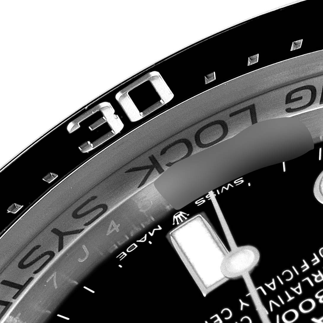 A close-up of the Rolex Sea-Dweller 126660 Men
s Stainless Steel Blue Dial 126660 Men
s Stainless Steel Blue Dial watch shows part of the bezel, dial, and minute markers.