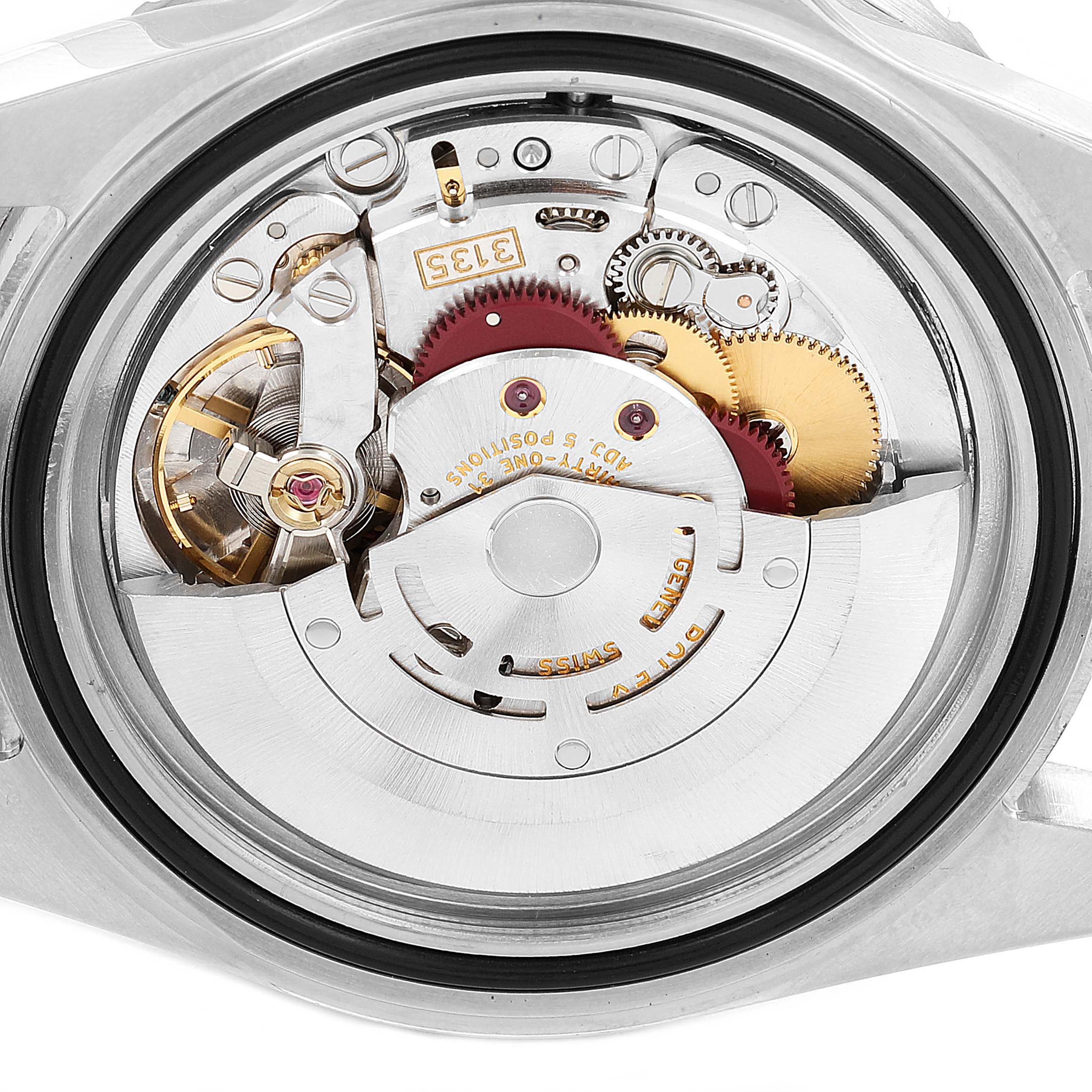 The image shows the internal mechanism of a Rolex Submariner 16610 Men's Stainless Steel Black Dial 16610 Men's Stainless Steel Black Dial watch from a rear angle, exposing its intricate gears and movement components.