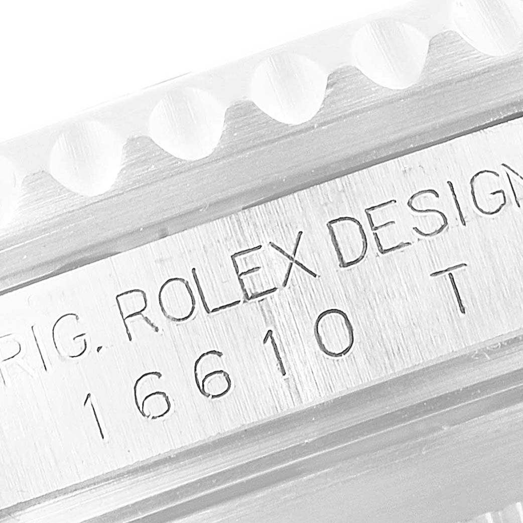 This image shows a close-up of the case side engraving on a Rolex Submariner 16610 Men's Stainless Steel Black Dial 16610 Men's Stainless Steel Black Dial watch, displaying the model number "16610".