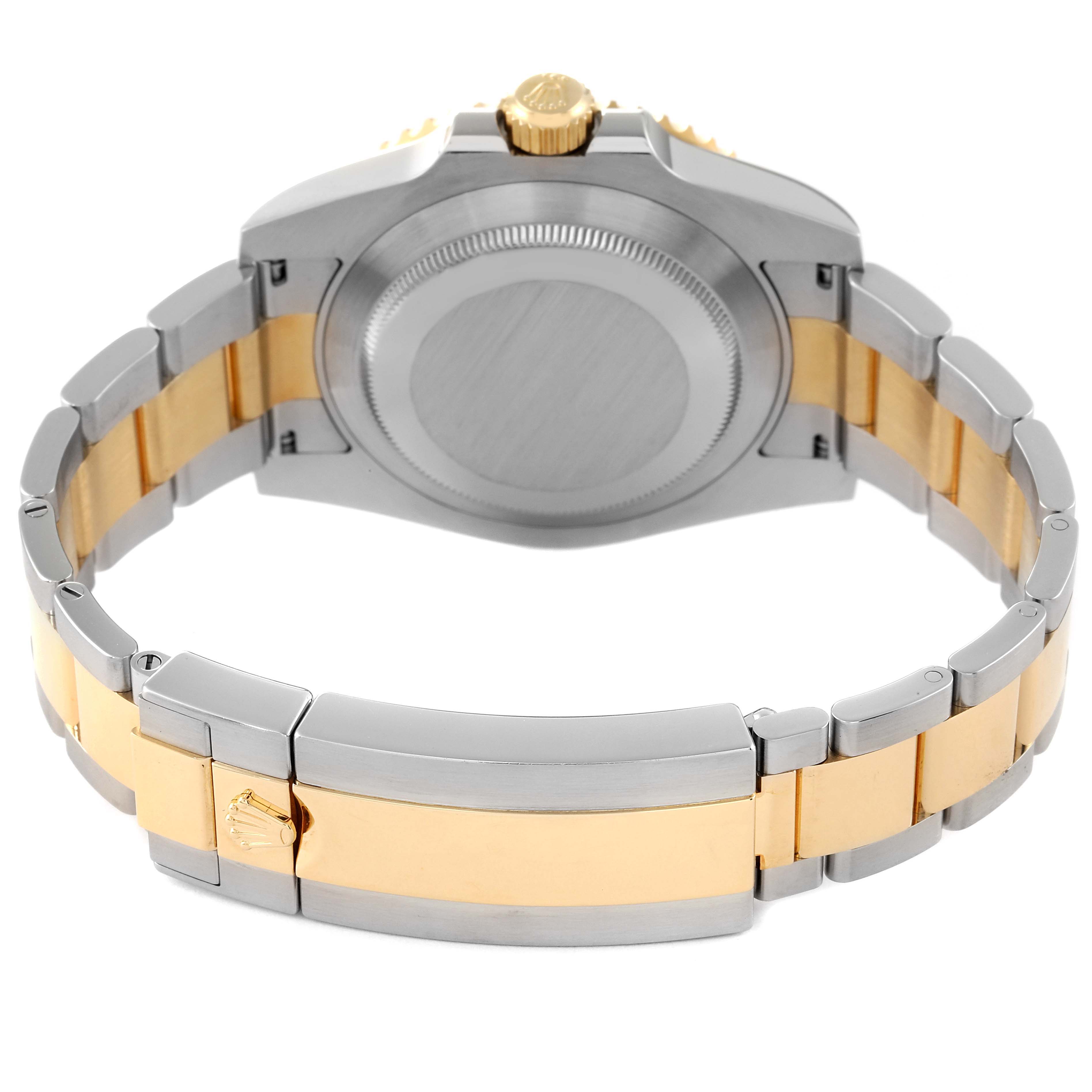 The image shows the backside and bracelet of the Rolex Submariner 116613 Men's Steel and Gold (two tone) Blue Dial 116613 Men's Steel and Gold (two tone) Blue Dial watch, displaying its two-tone metal design.