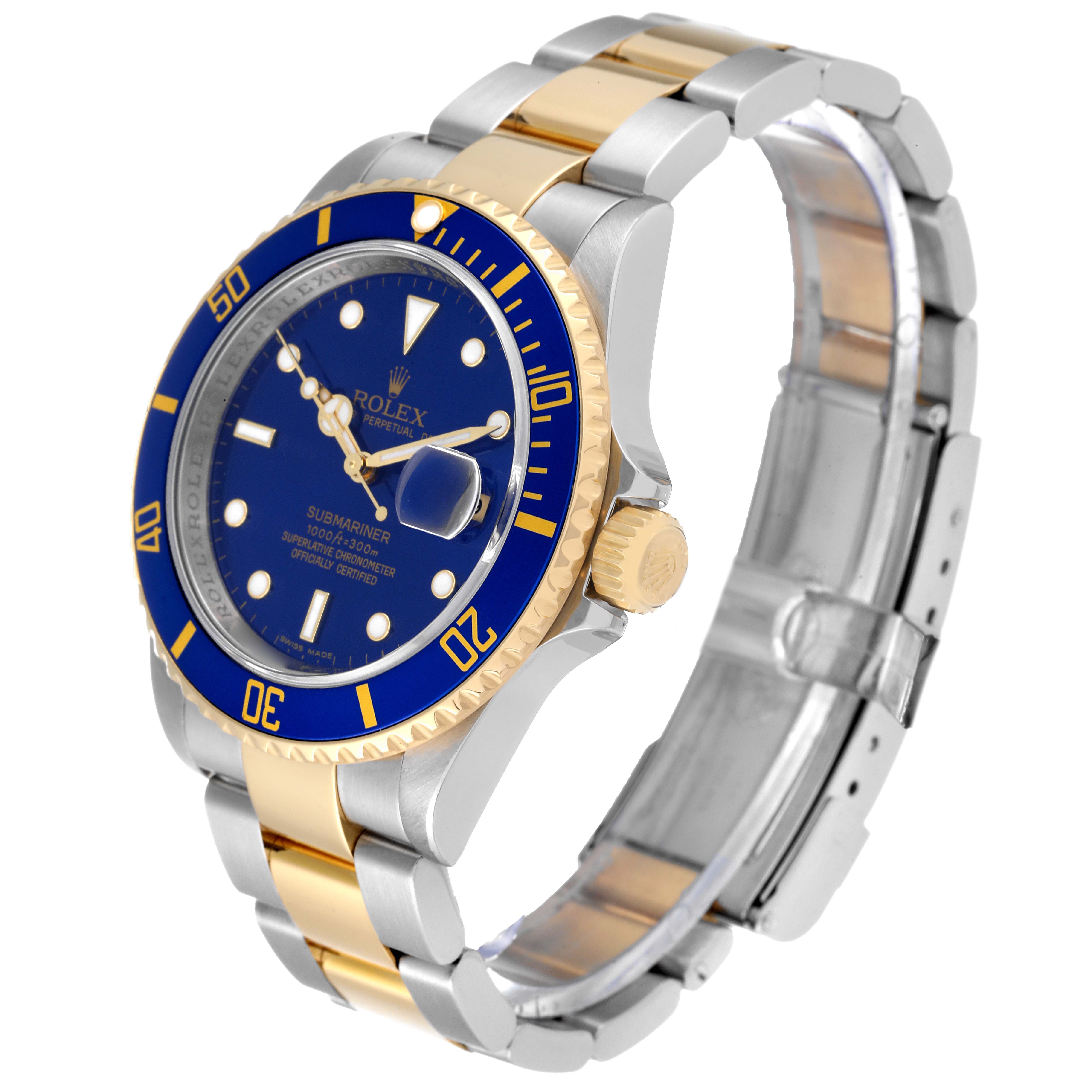 The image shows a Rolex Submariner 16613 Men
s Stainless Steel Blue Dial 16613 Men
s Stainless Steel Blue Dial watch at a three-quarter angle, highlighting the blue dial, bezel, and two-tone bracelet.