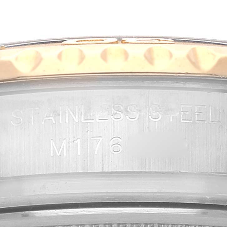 This close-up shot of the Rolex Yacht-Master 169623 Women's Steel and Gold (two tone) Blue Dial 169623 Women's Steel and Gold (two tone) Blue Dial watch shows a portion of the bezel and engraved text on the case.