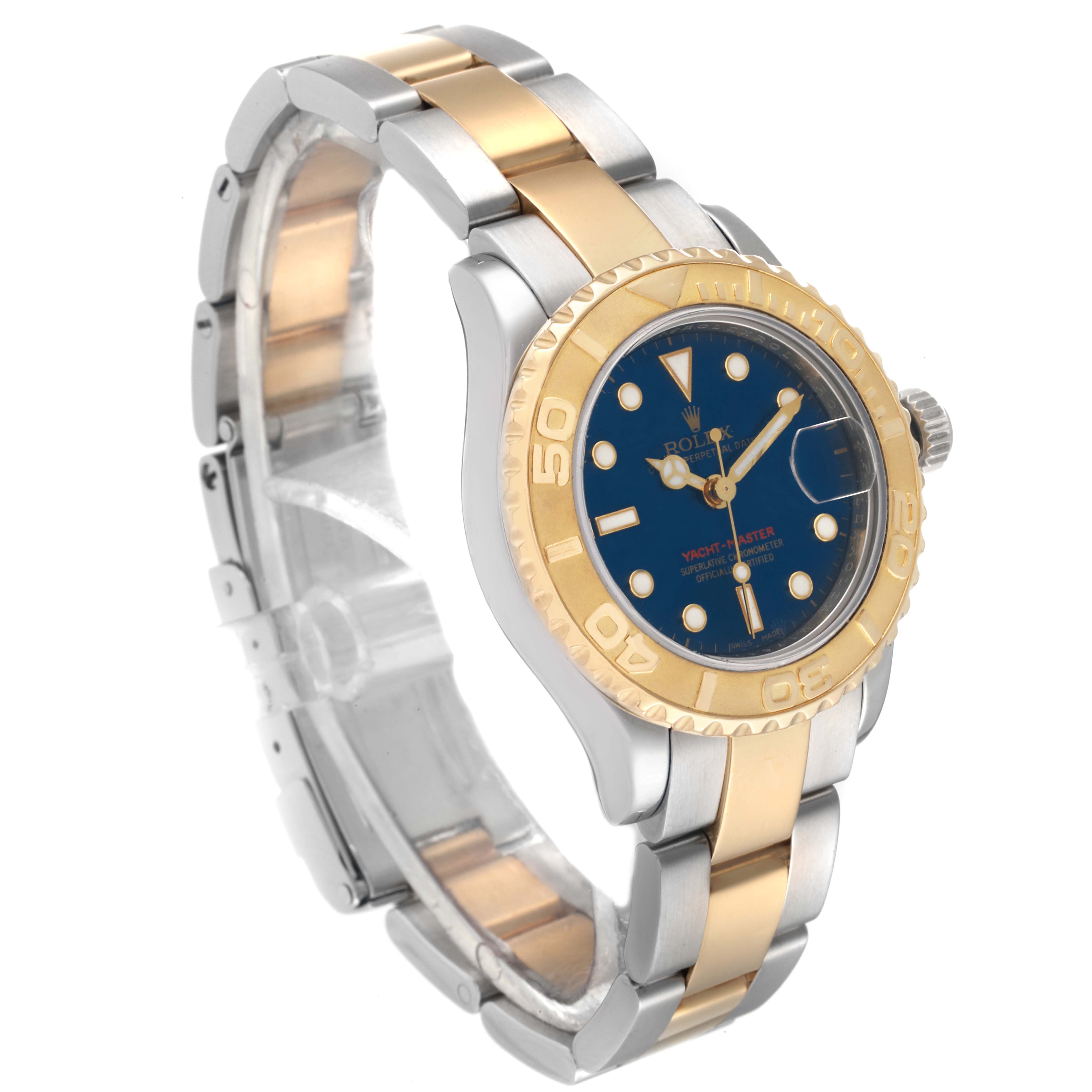 The image shows a Rolex Yacht-Master 169623 Women's Steel and Gold (two tone) Blue Dial 169623 Women's Steel and Gold (two tone) Blue Dial watch angled to display the face, bezel, and part of the bracelet.