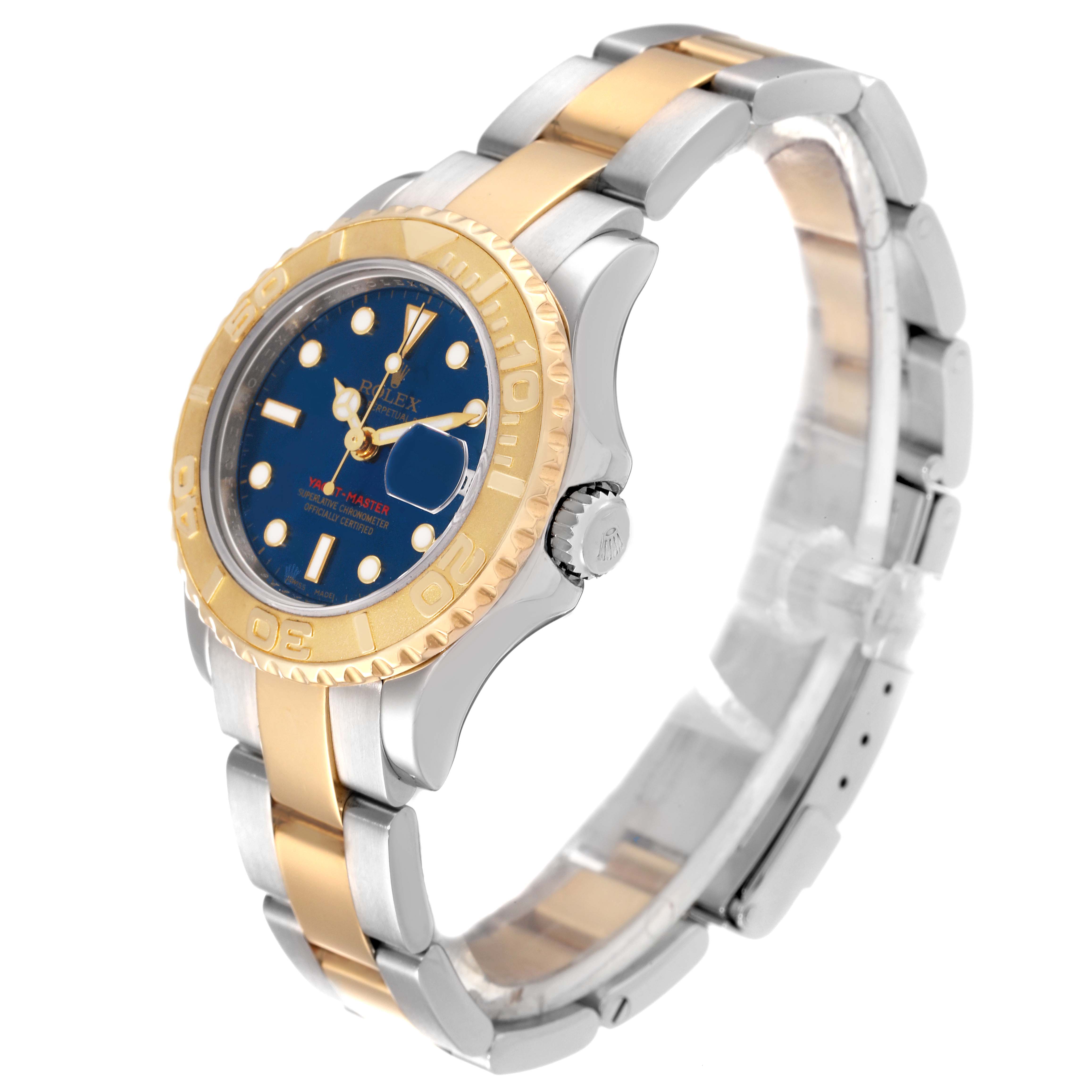 The image shows a Rolex Yacht-Master 169623 Women's Steel and Gold (two tone) Blue Dial 169623 Women's Steel and Gold (two tone) Blue Dial watch at a slight angle, highlighting its blue dial, gold bezel, crown, and two-tone bracelet.