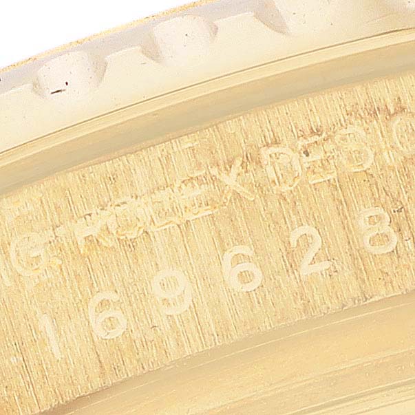 The image shows a close-up of the engraved side of the bezel for the Rolex Yacht-Master 169628 Women's Yellow Gold White Dial 169628 Women's Yellow Gold White Dial model.