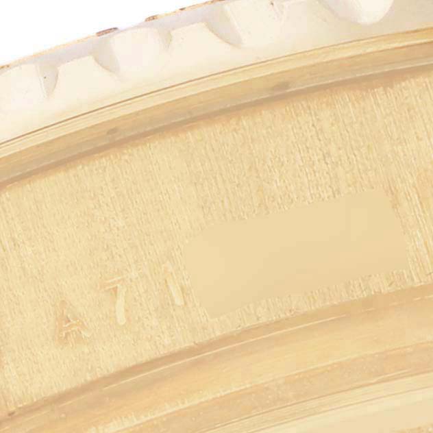 This image shows a close-up of the Rolex Yacht-Master 169628 Women's Yellow Gold White Dial 169628 Women's Yellow Gold White Dial bezel with visible engraved markings.
