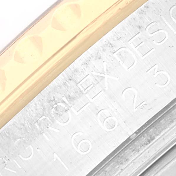 The image shows a close-up of the bezel and edge of the case of a Rolex Yacht-Master 16623 Men's Steel and Gold (two tone) Grey Dial 16623 Men's Steel and Gold (two tone) Grey Dial watch.